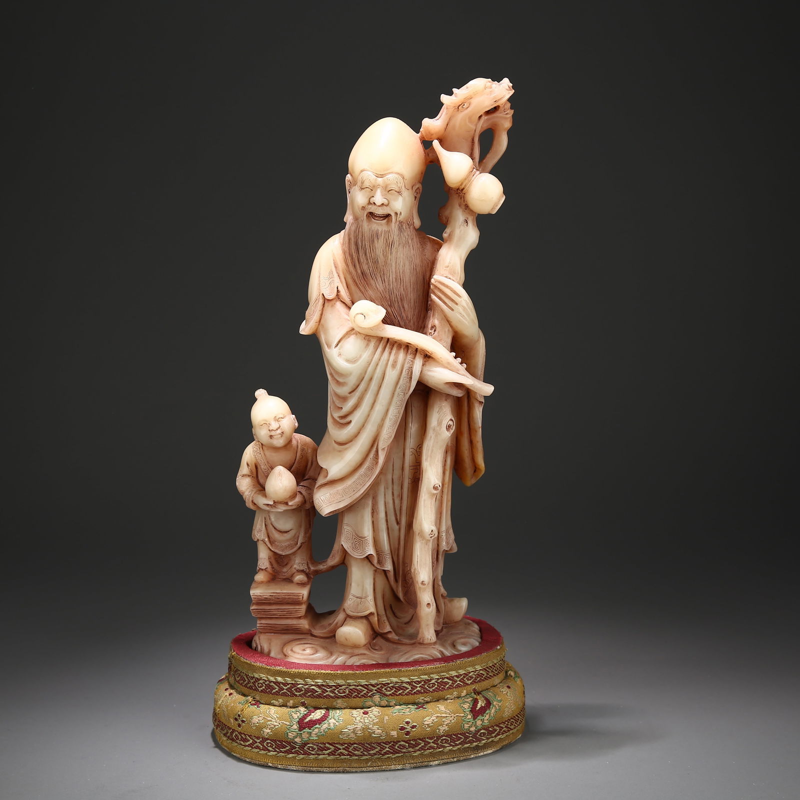 A SHOUSHAN STONE SHOU XING (GOD OF LONGEVITY) FIGURE: Shoushan stone Shou Xing (God of Longevity) figure