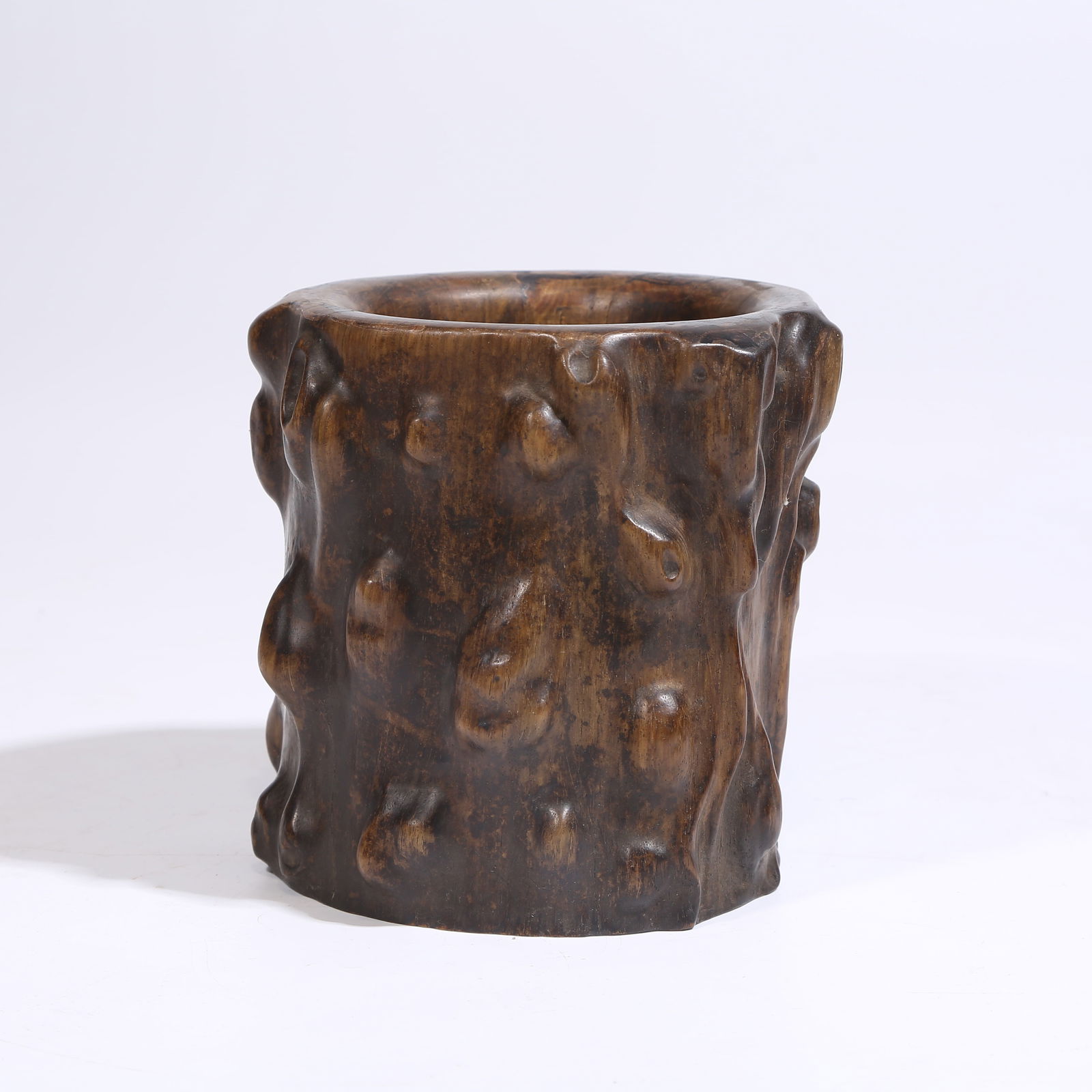 A HUANGHUALI WOOD BURL PEN HOLDER: Huanghuali Wood Burl Pen Holder