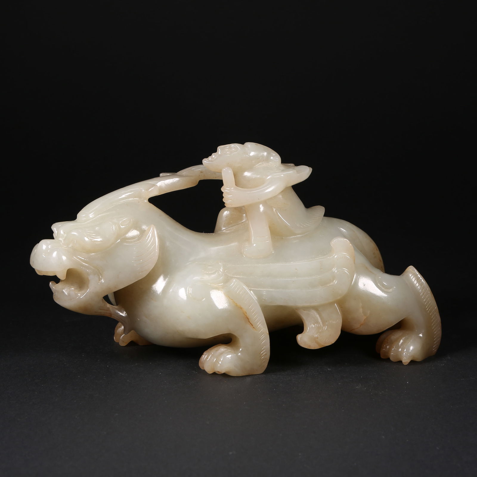 A HETIAN JADE AUSPICIOUS BEAST ORNAMENT: Hetian jade auspicious beast ornament