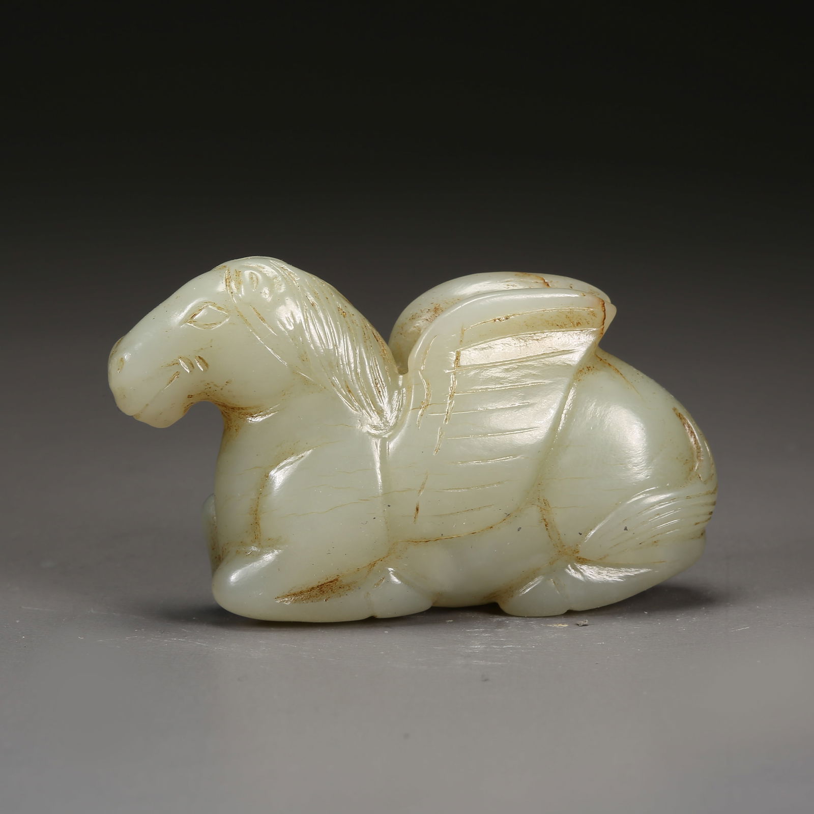 A HETIAN JADE CELESTIAL HORSE PENDANT: Hetian jade celestial horse pendant
