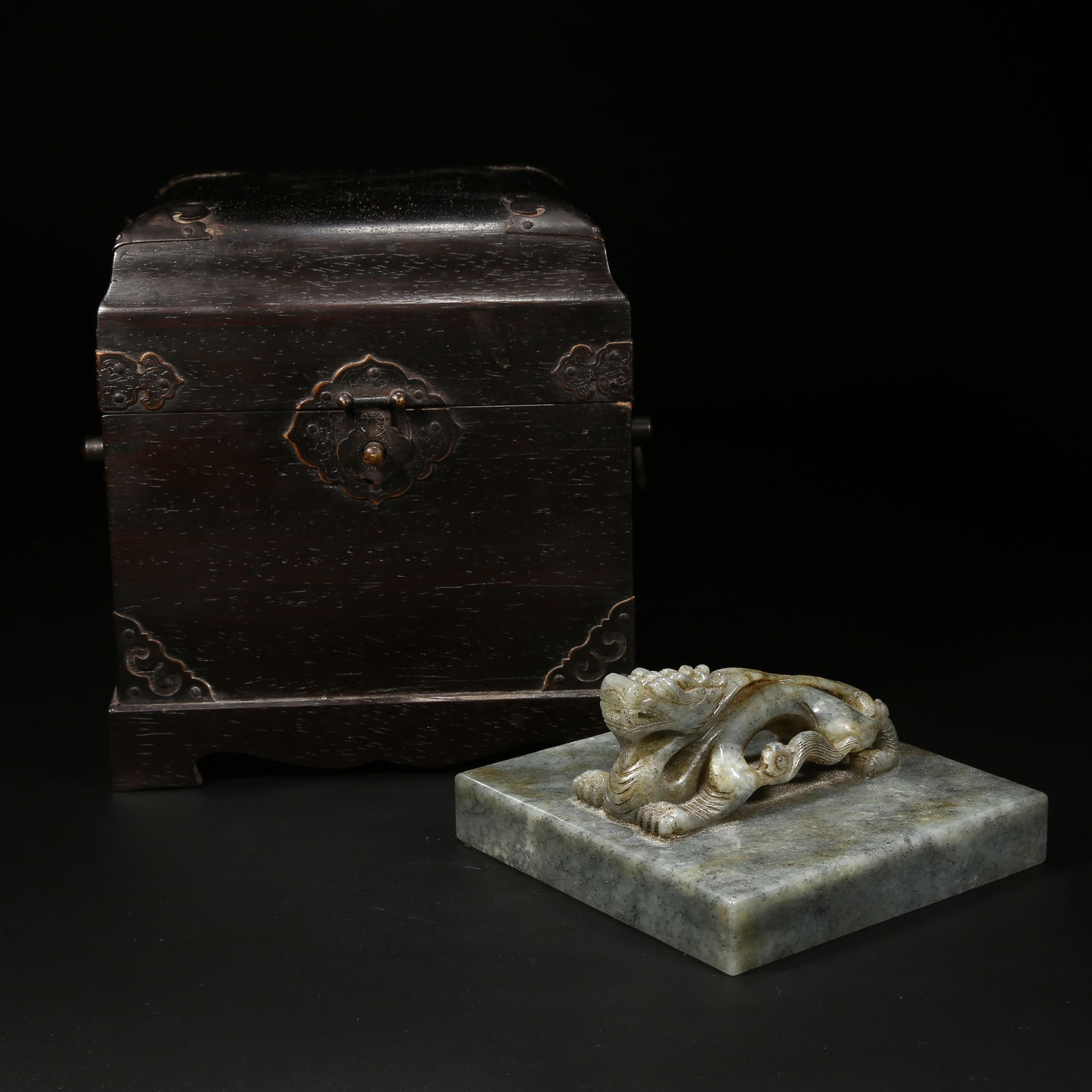 A HETIAN JADE SEAL WITH DRAGON KNOB IN CELADON SEED JADE: Hetian jade seal with dragon knob in celadon seed jade