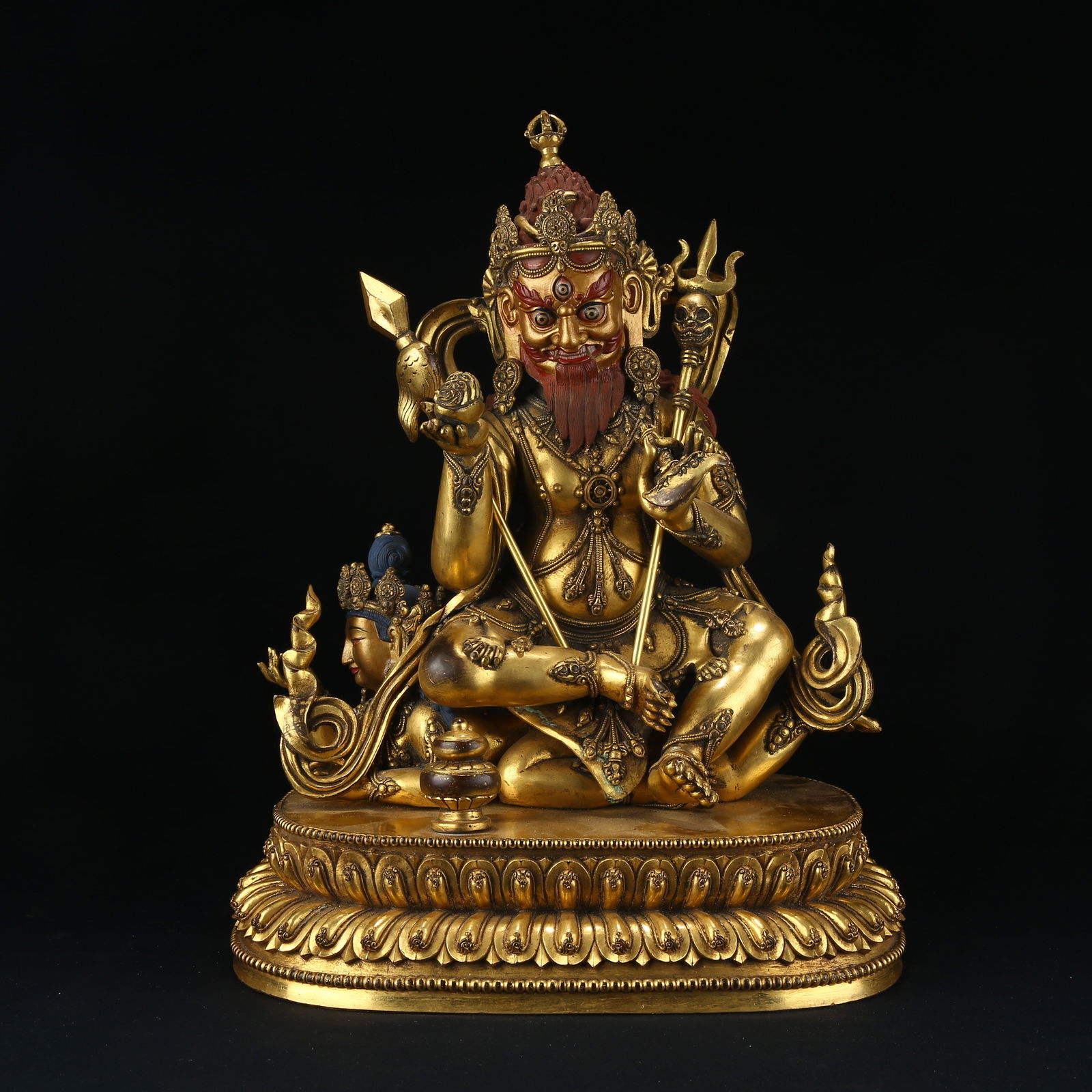 A GILT BRONZE DHARMAPALA (PROTECTOR DEITY) STATUE: Gilt bronze Dharmapala (Protector Deity) statue