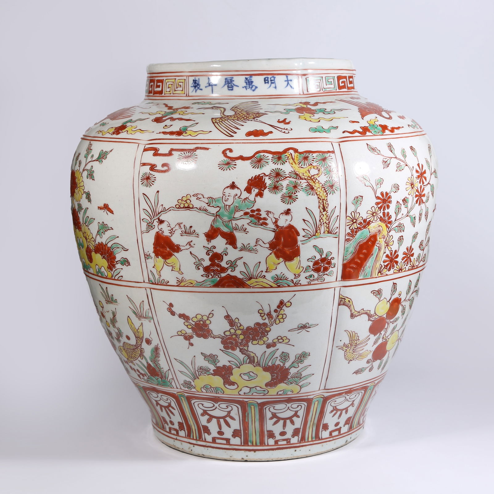 A RED-AND-GREEN ENAMEL JAR WITH CHILDREN-AT-PLAY SCENE: Red-and-Green Enamel Jar with Children-at-Play Scene