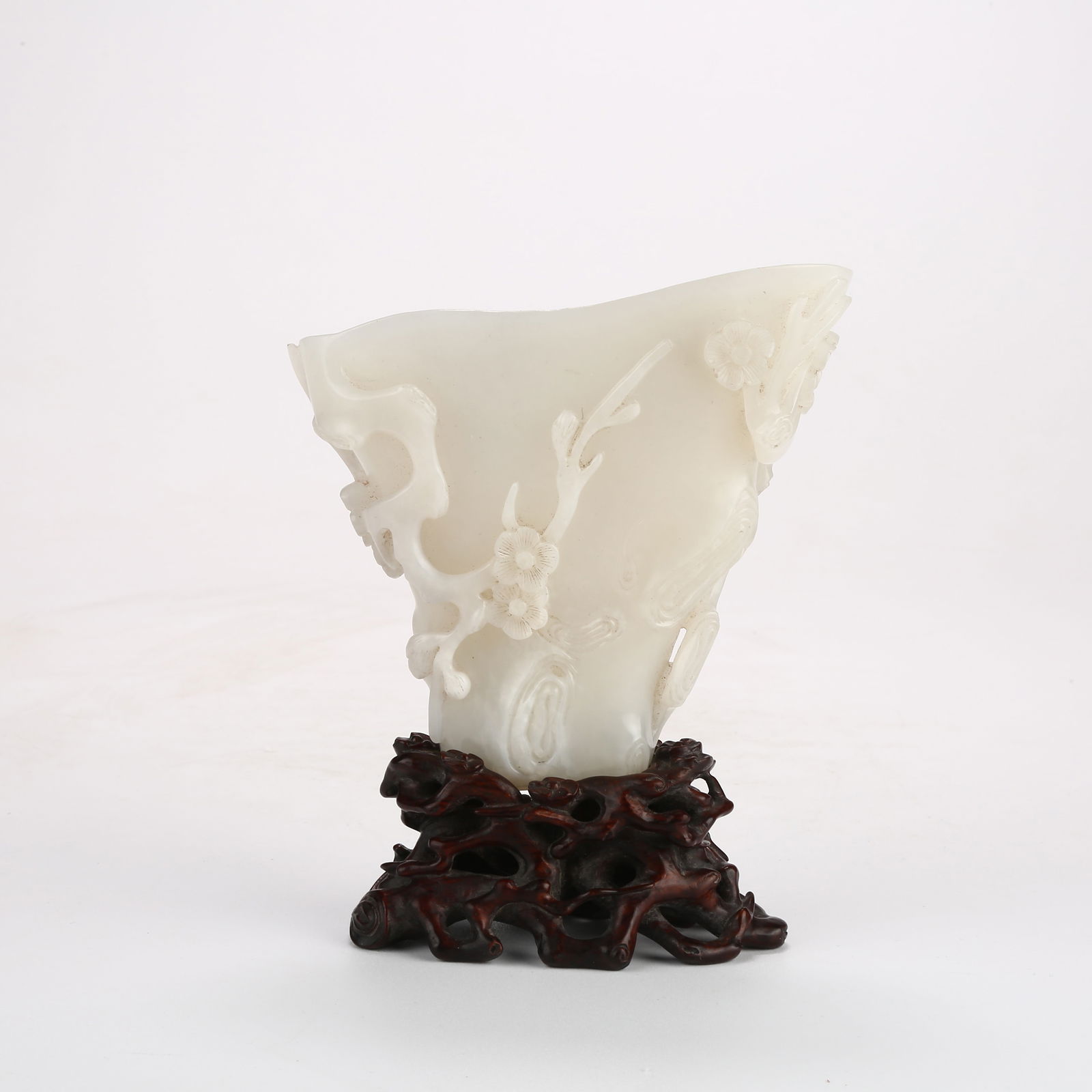 A HETIAN WHITE JADE WATER POT WITH PLUM BLOSSOM DESIGN: Hetian White Jade Water Pot with Plum Blossom Design