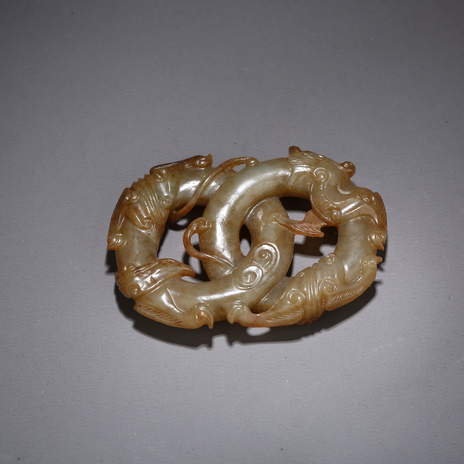 A HETIAN JADE DOUBLE RING WITH DRAGON AND PHOENIX DESIGN: Hetian jade double ring with dragon and phoenix design