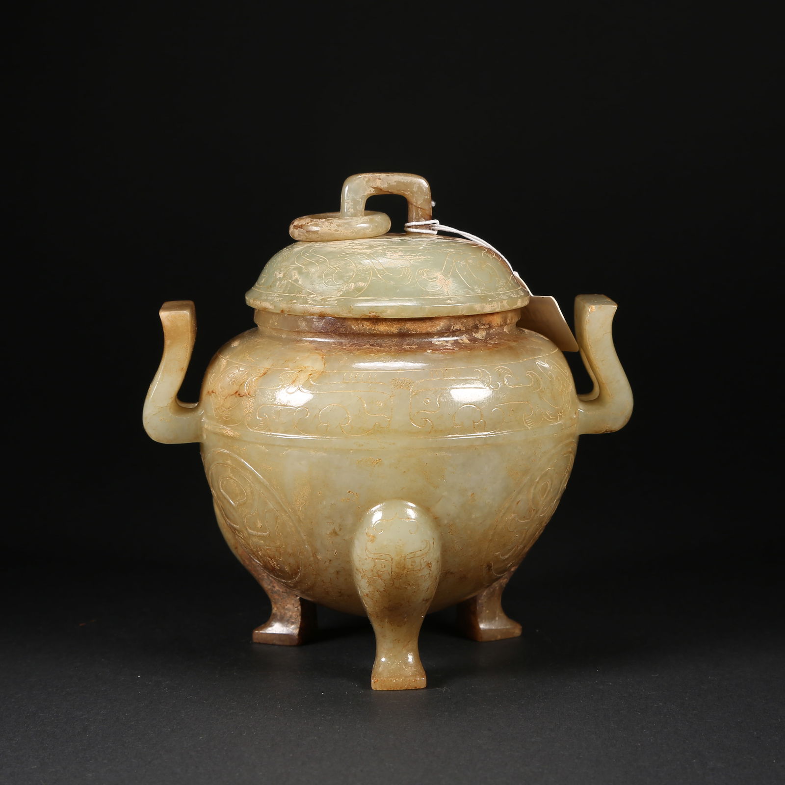 A HETIAN JADE TRIPOD CENSER WITH DOUBLE EARS, BEAST MASK, DRAGON–PHOENIX MOTIFS AND MOVABLE RINGS, (1 of 8)