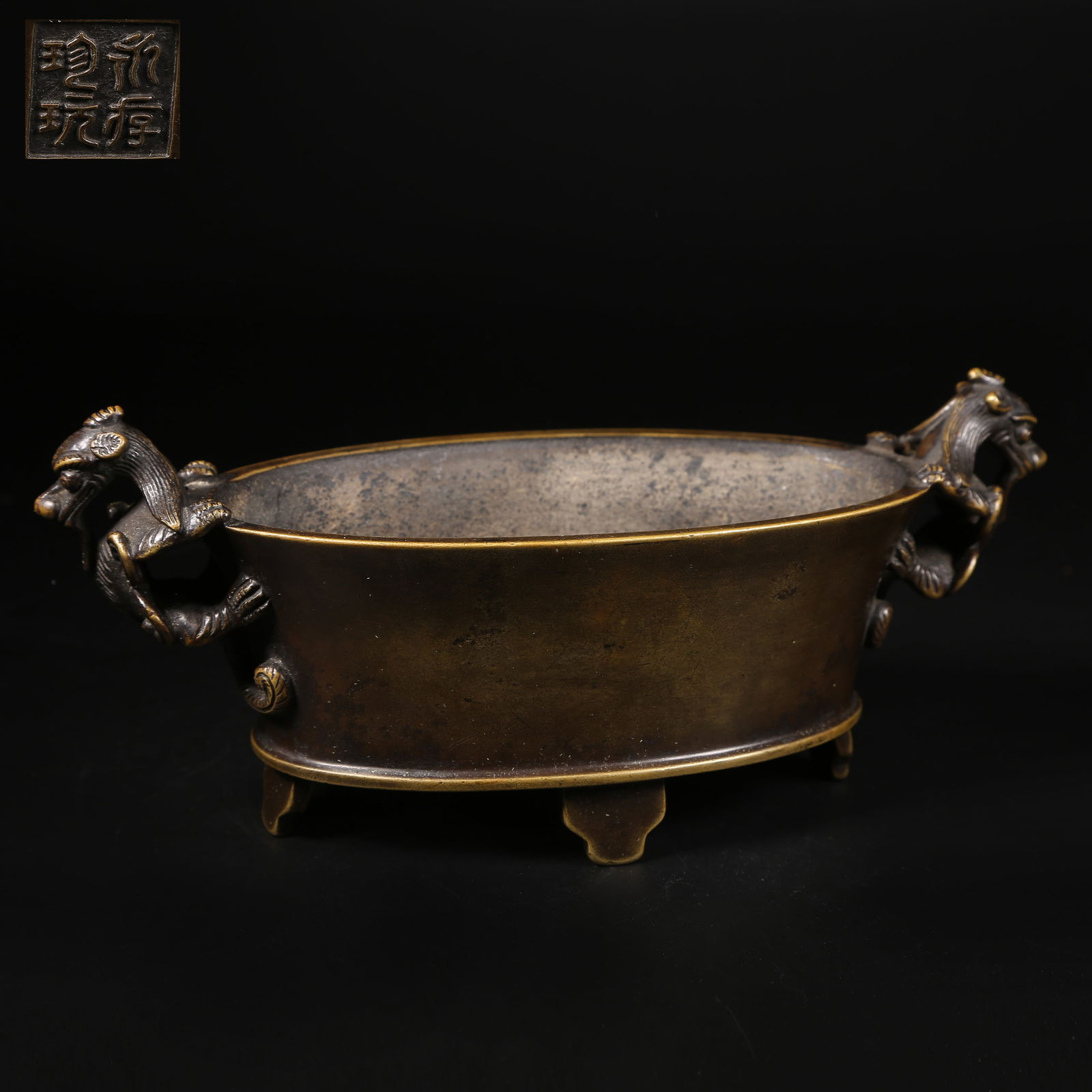 A BRONZE CHI-DRAGON HANDLED CENSER: Bronze chi-dragon handled censer