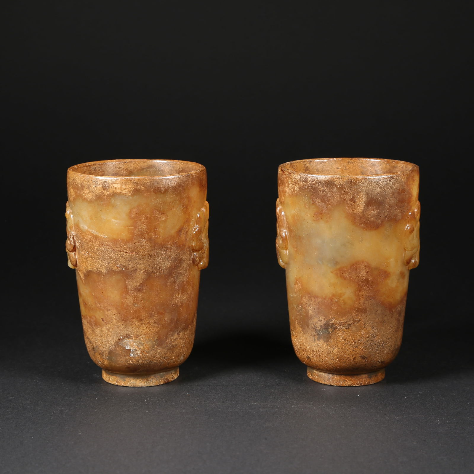A SET OF HETIAN JADE BEAST-MASK CUPS: Set of Hetian jade beast-mask cups