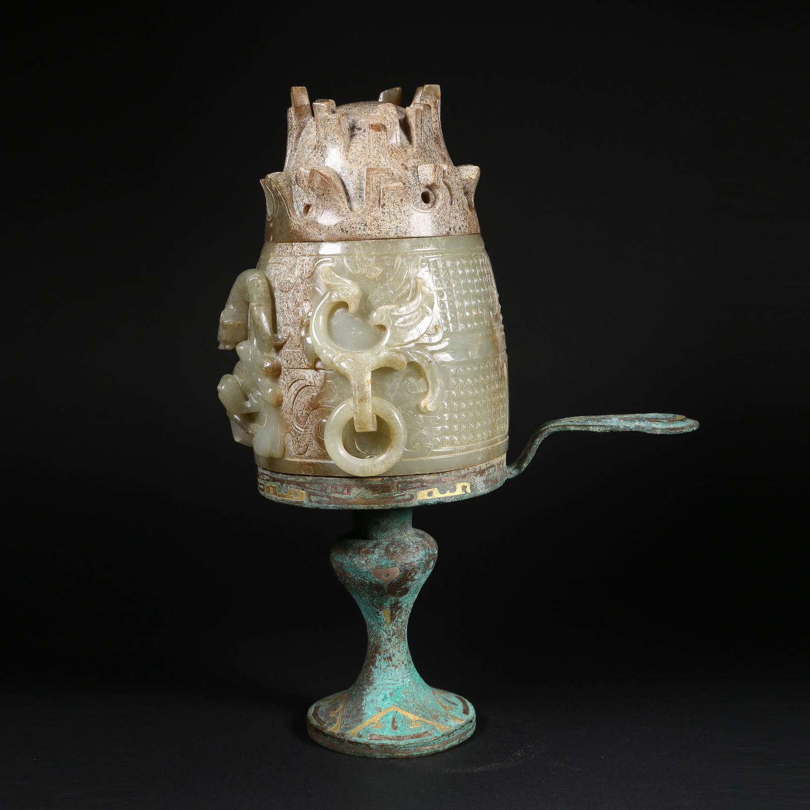 A HETIAN JADE BOSHAN CENSER WITH GILT AND SILVER ACCENTS, MOVABLE RINGS, AND: Hetian jade Boshan censer with gilt and silver accents, movable rings, and dragon-phoenix–beast-mask decoration