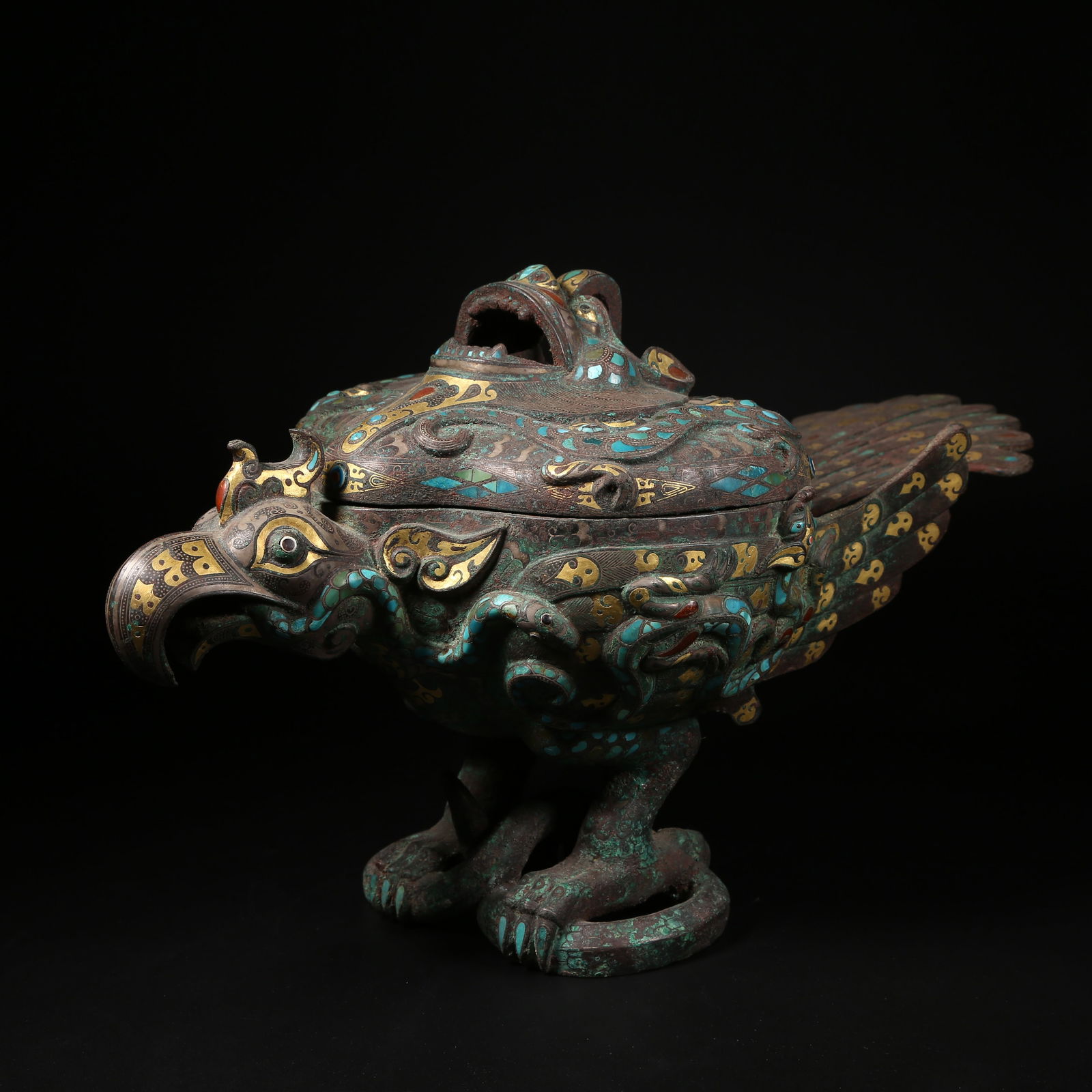 A GILT-AND-INLAID BRONZE EAGLE INCENSE BURNER: Gilt-and-inlaid bronze eagle incense burner