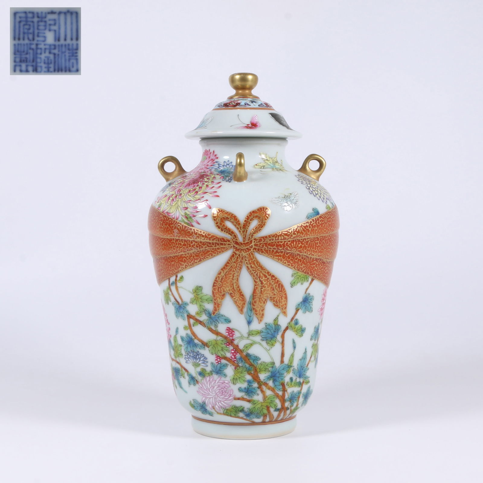 A FAMILLE ROSE JAR WITH "BUNDLE, FLOWERS, AND BUTTERFLIES" DESIGN AND FOUR LUGS: Famille Rose Jar with "Bundle, Flowers, and Butterflies" Design and Four Lugs