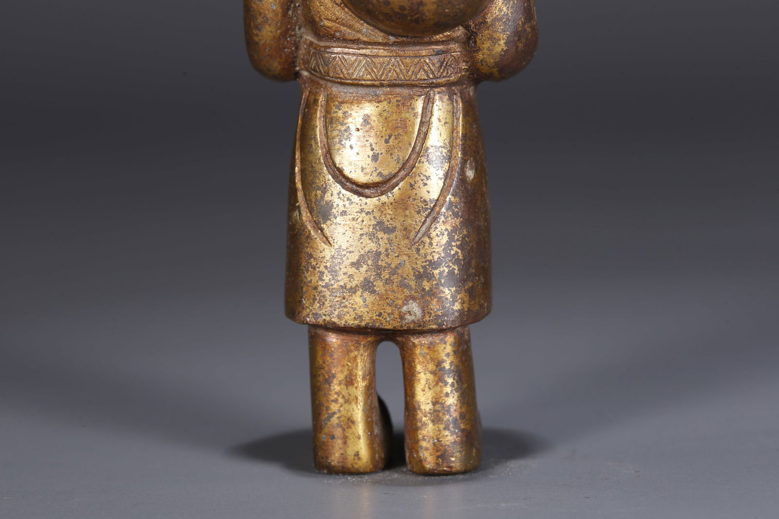 A GILDED BRONZE FIGURINE - 8