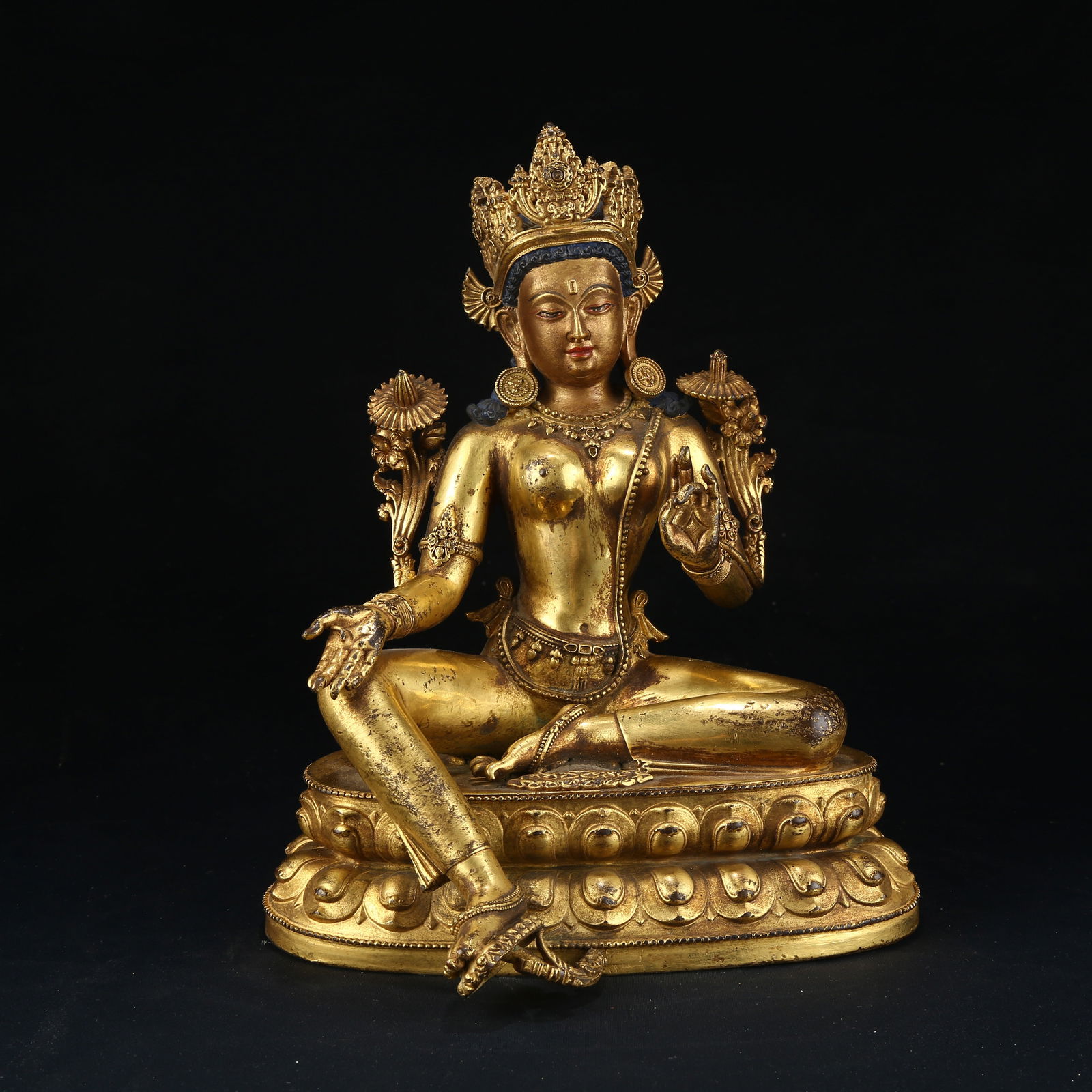 A GILT BRONZE STATUE OF GREEN TARA: Gilt bronze statue of Green Tara