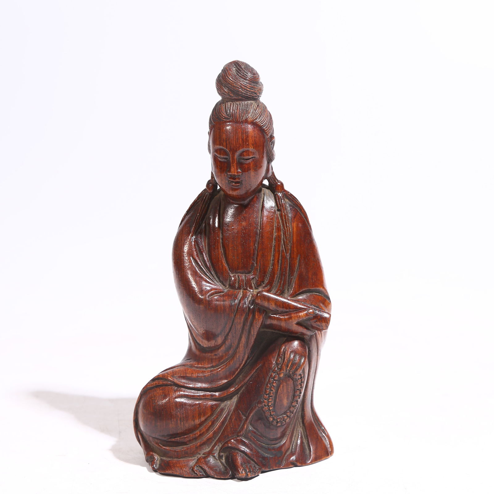 A HUANGHUALI WOOD GUANYIN HOLDING SCROLL: Huanghuali Wood Guanyin Holding Scroll