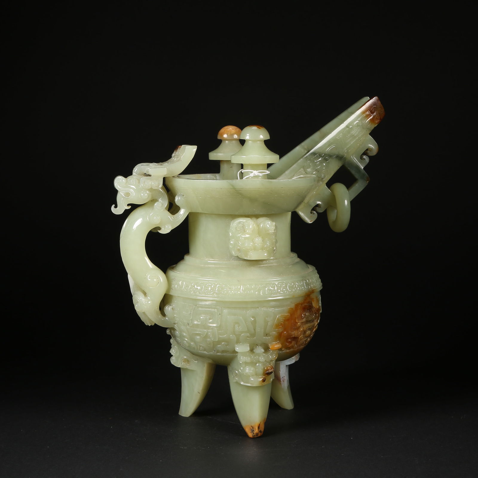 A HETIAN JADE HORN CUP WITH DRAGON HEAD AND MOVABLE RING: Hetian jade horn cup with dragon head and movable ring