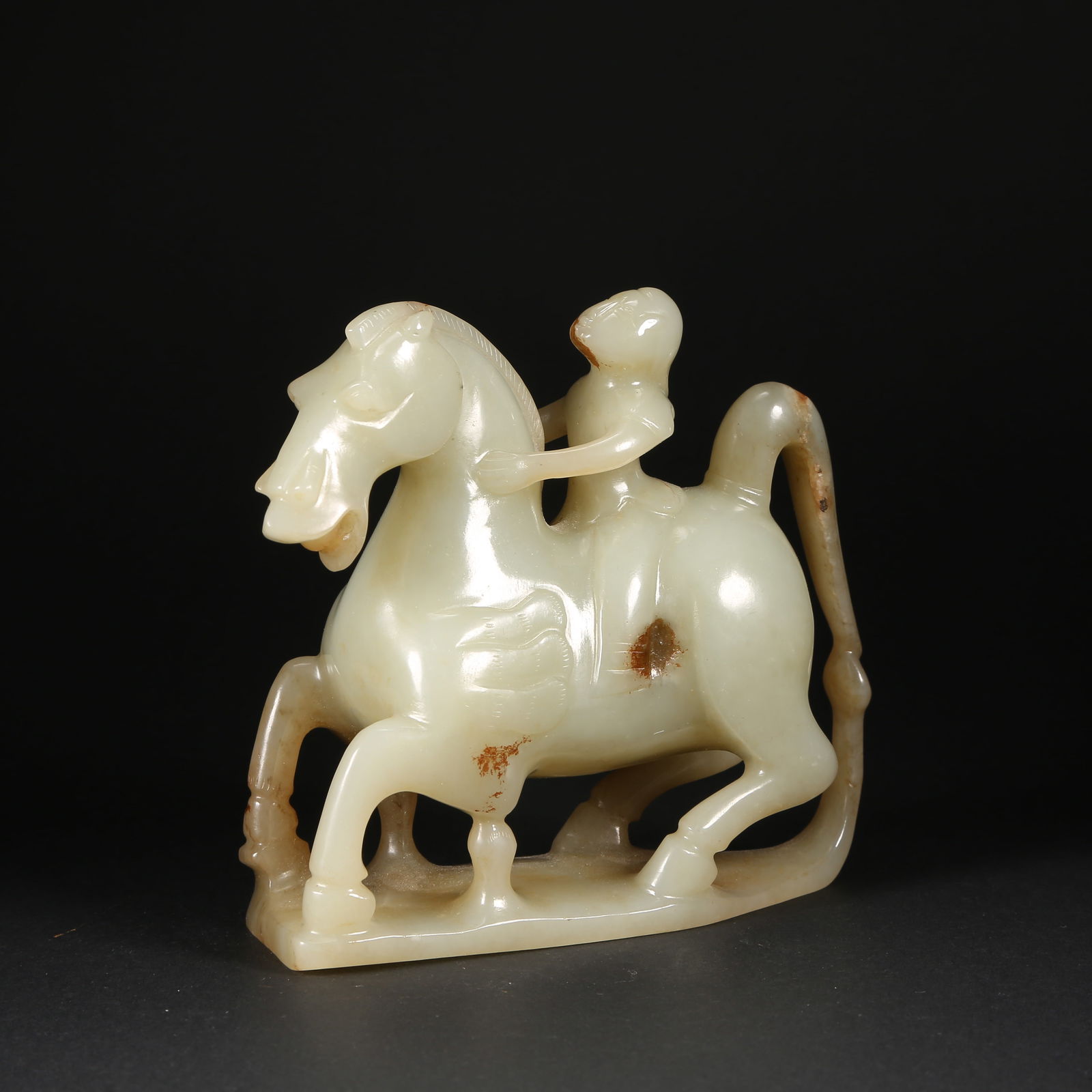 A HETIAN JADE "SUCCESS UPON ARRIVAL" HORSE FIGURE: Hetian jade "Success Upon Arrival" horse figure