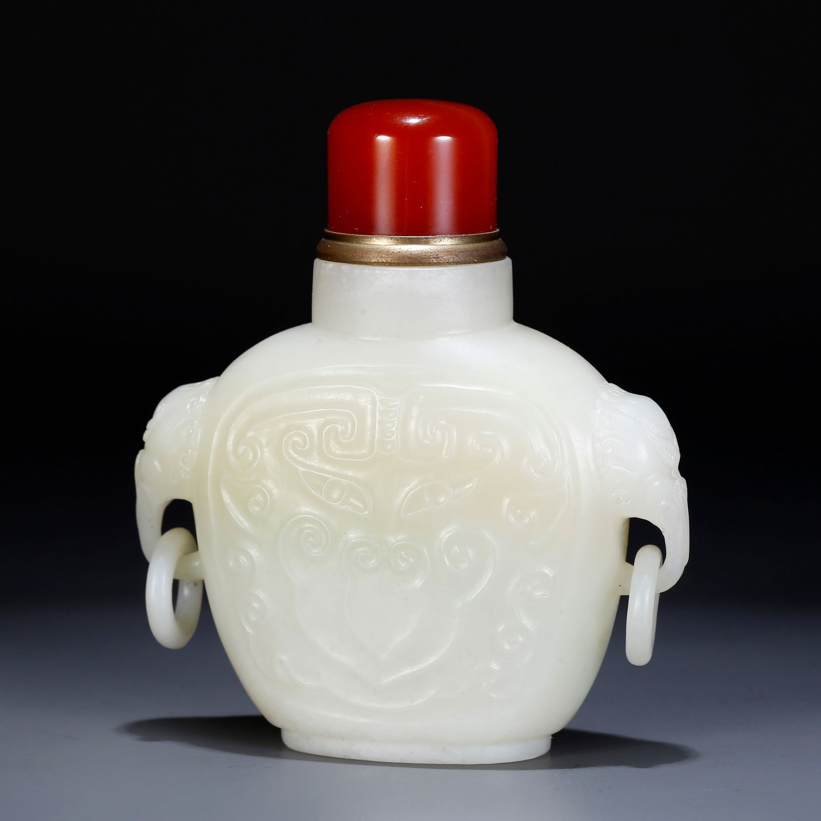 A HETIAN JADE CARVED SNUFF BOTTLE WITH BEAST FACE PATTERN: Hetian jade carved snuff bottle with beast face pattern