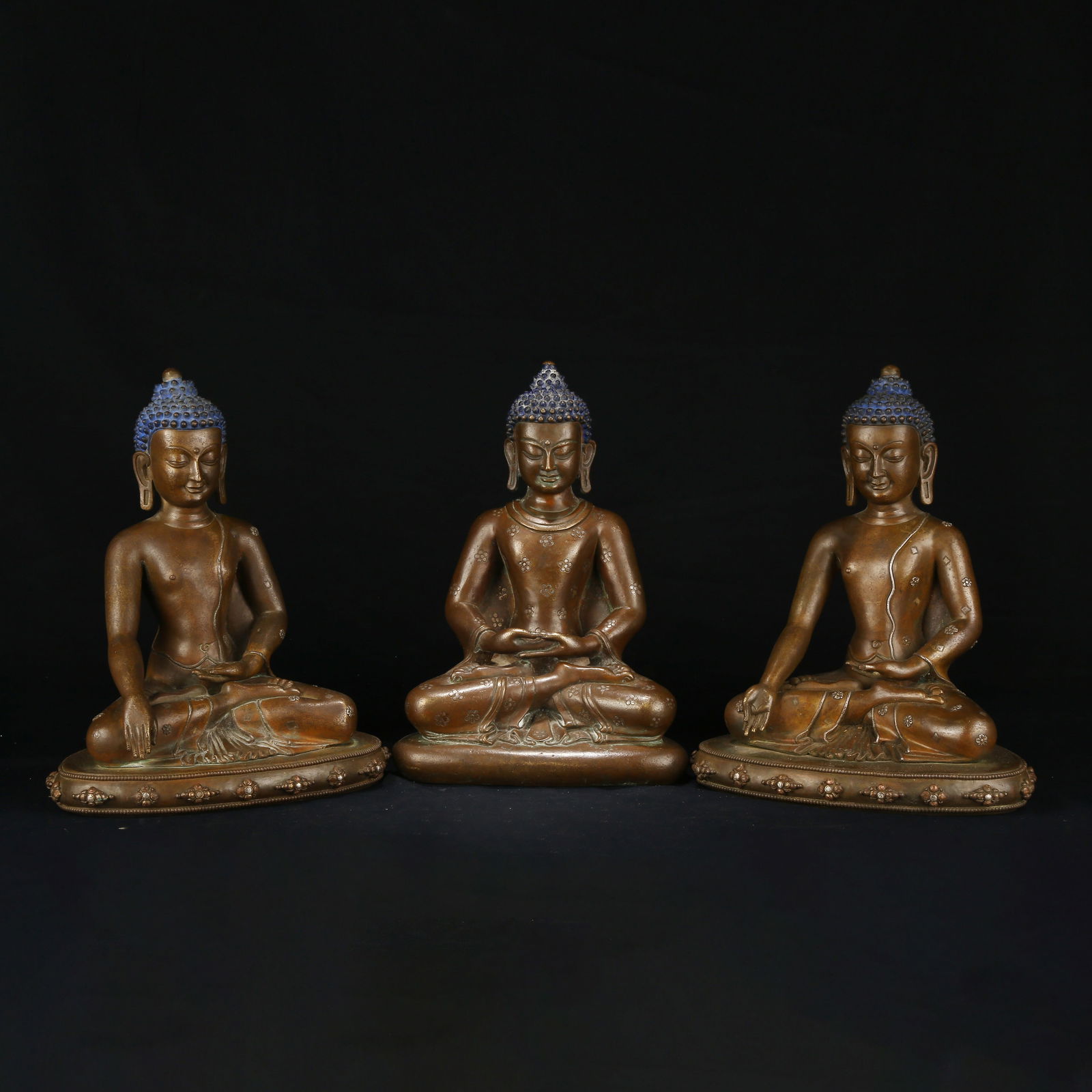 A SET OF BRONZE INLAID SILVER THREE BUDDHAS: Set of Bronze Inlaid Silver Three Buddhas