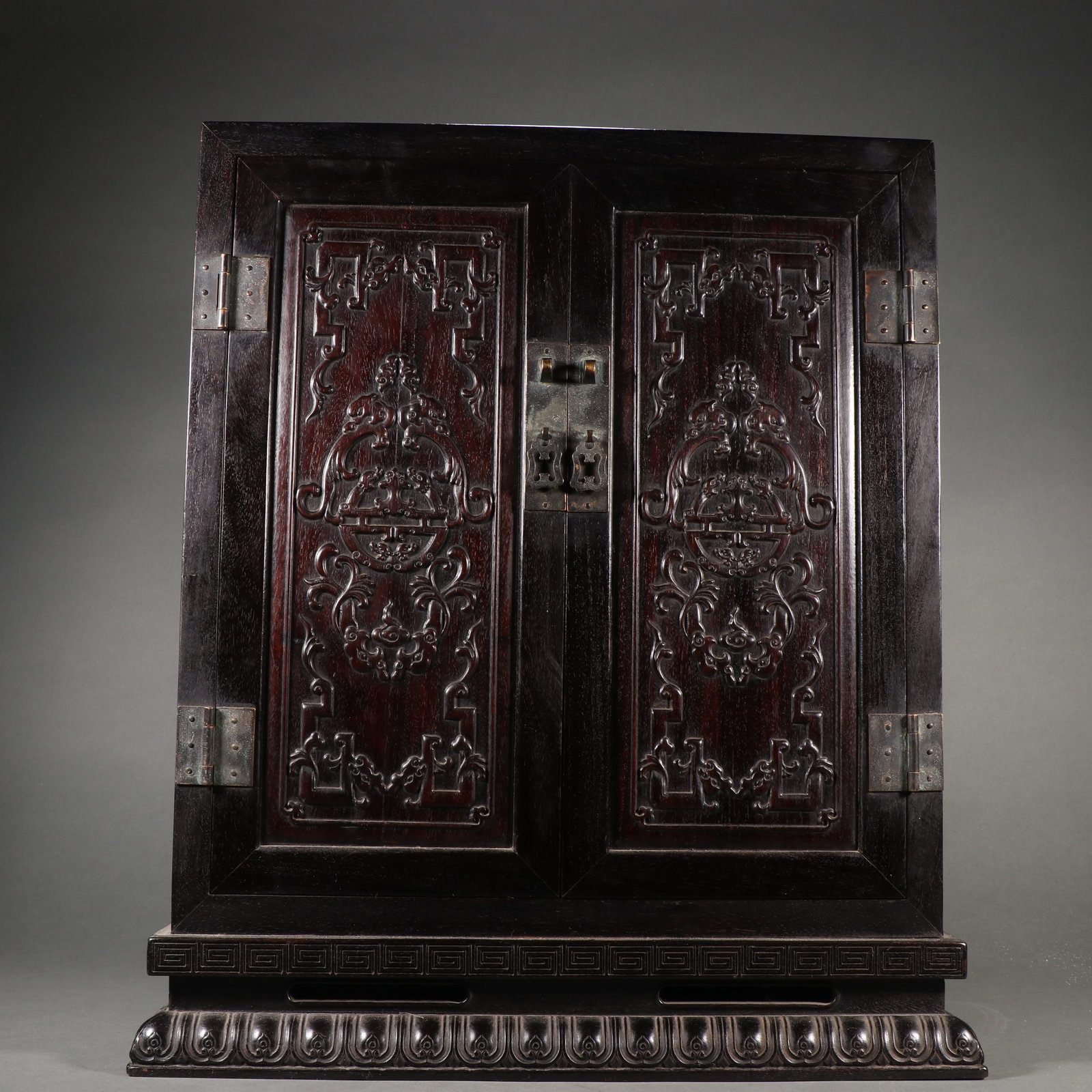 A ZITAN CABINET WITH DRAGON MOTIFS: Zitan Cabinet with Dragon Motifs