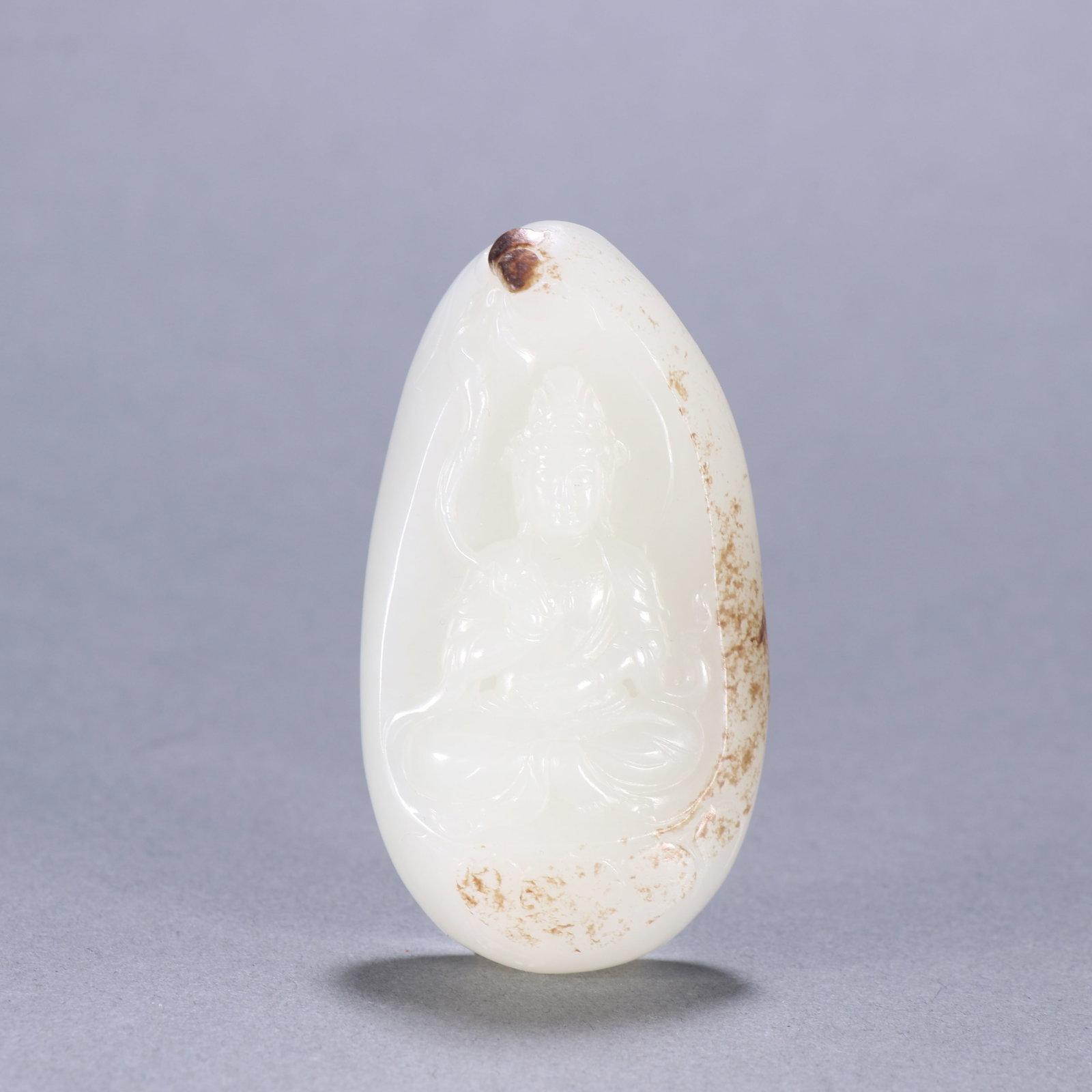 A HETIAN JADE GUANYIN PENDANT: Hetian Jade Guanyin Pendant
