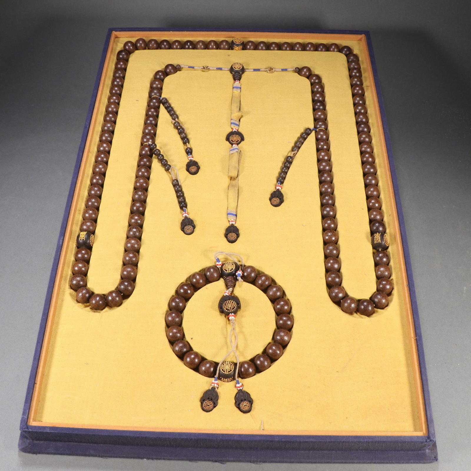 A AGARWOOD TRAY OF PRAYER BEADS: Agarwood Tray of Prayer Beads