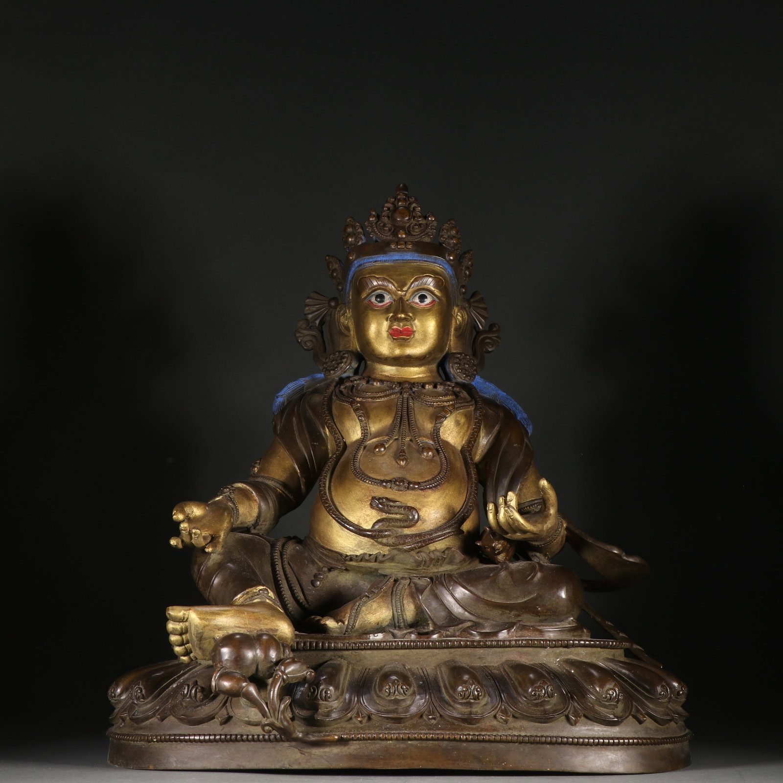 A GILDED BRONZE STATUE OF YELLOW JAMBHALA: Gilded Bronze Statue of Yellow Jambhala