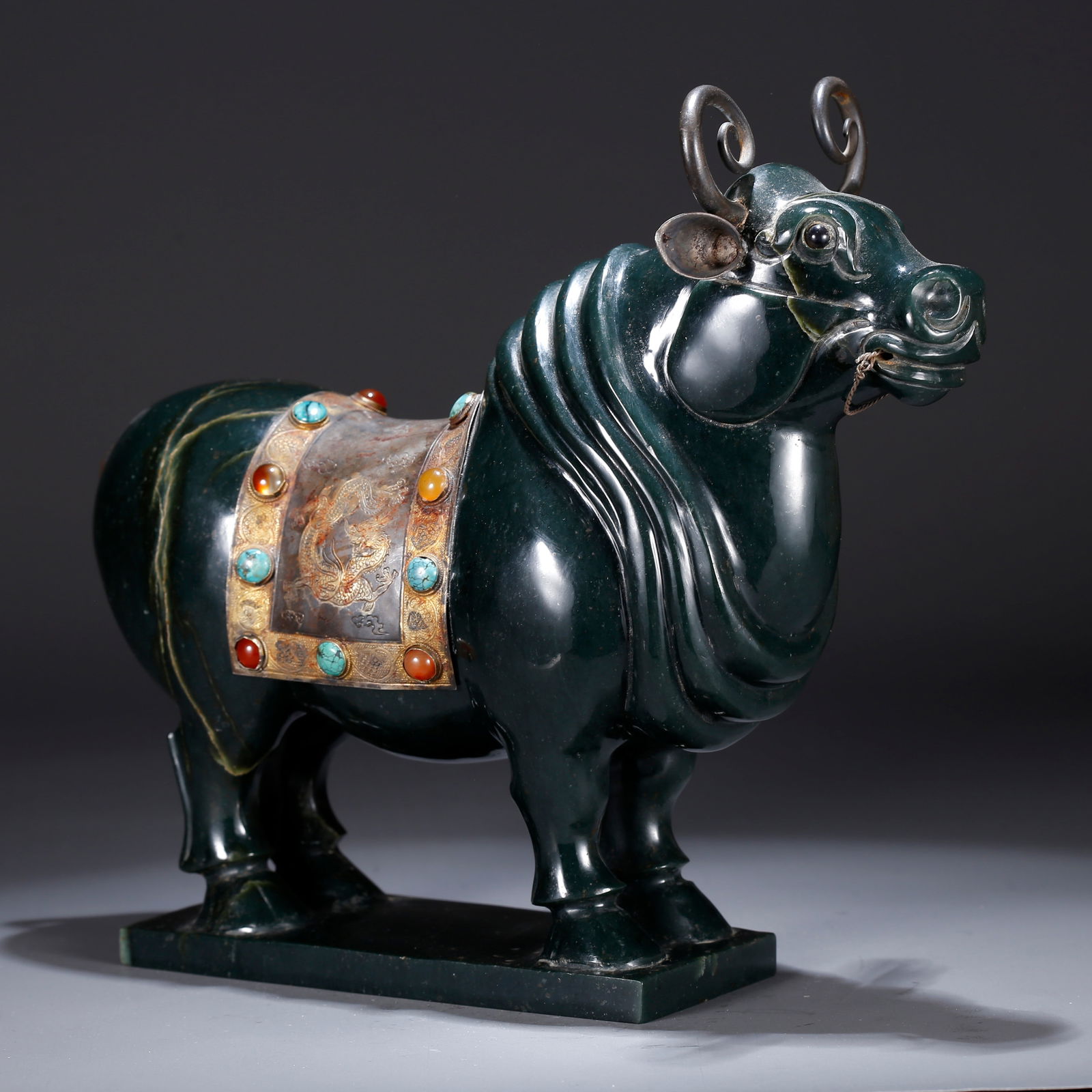 A HETIAN GREEN JADE AUSPICIOUS BEAST ORNAMENT: Hetian Green Jade Auspicious Beast Ornament