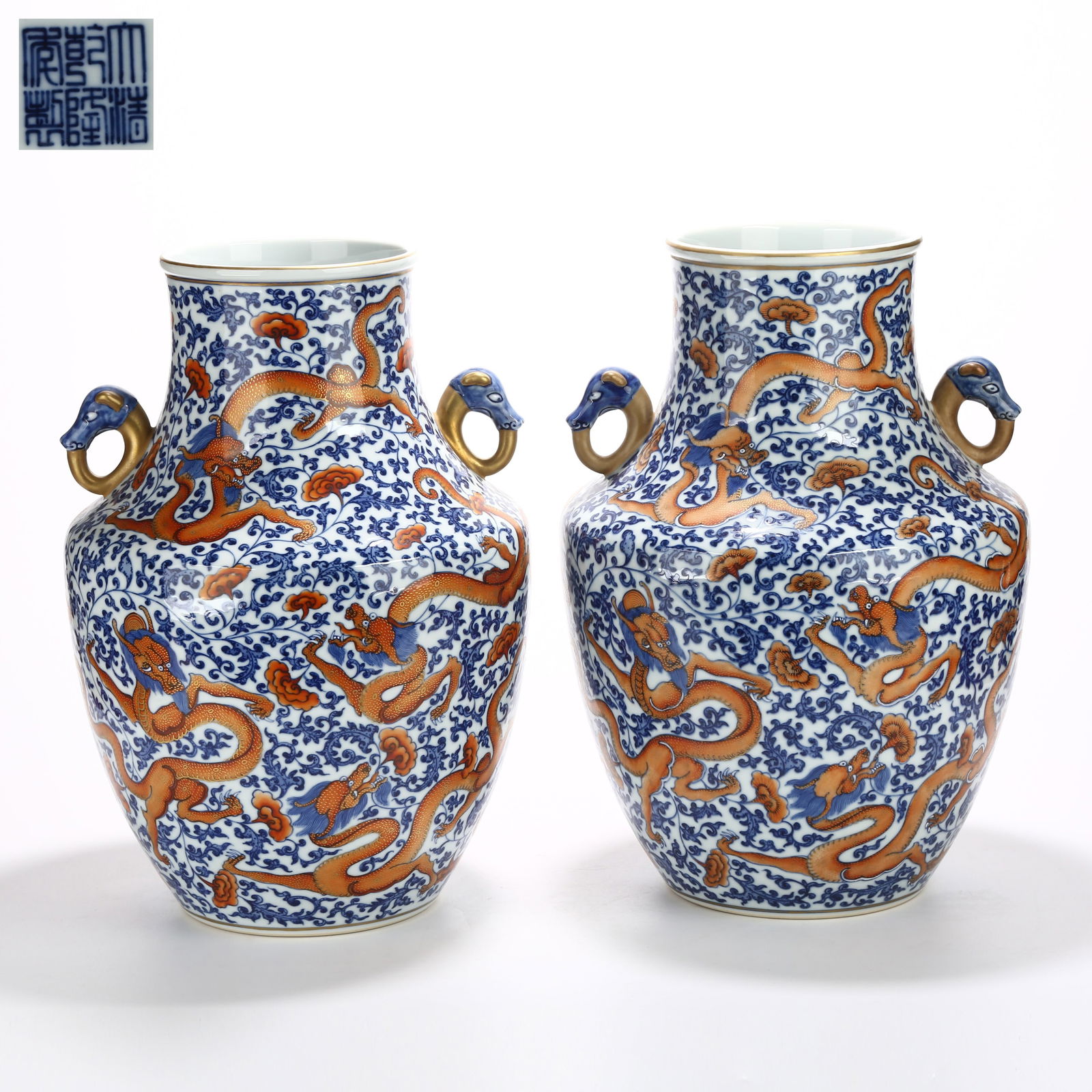 A SET OF BLUE AND WHITE WITH UNDERGLAZE RED PIERCING FLOWER AND DRAGON MOTIF BEAST-HANDLED VASES: Set of Blue and White with Underglaze Red Piercing Flower and Dragon Motif Beast-Handled Vases