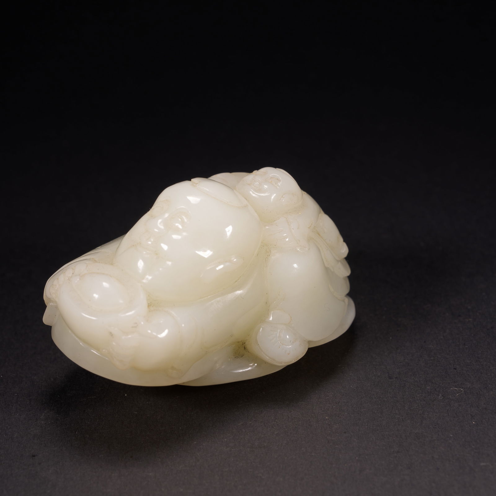 A HETIAN JADE "WEALTH-BRINGING BOY" ORNAMENT, QING DYNASTY (1 of 8)