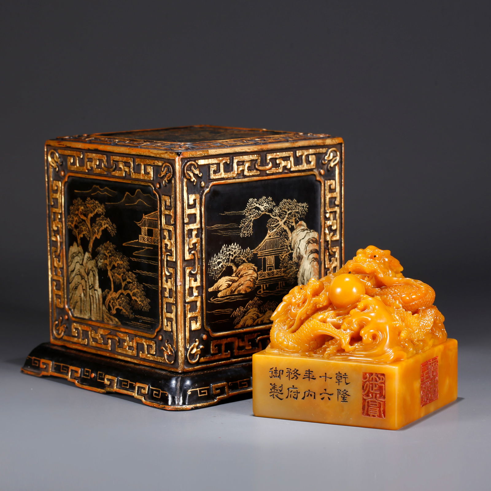 A SHOUSHAN TIANHUANG STONE SEAL WITH TWIN DRAGONS PLAYING WITH A PEARL KNOB: Shoushan Tianhuang stone seal with twin dragons playing with a pearl knob