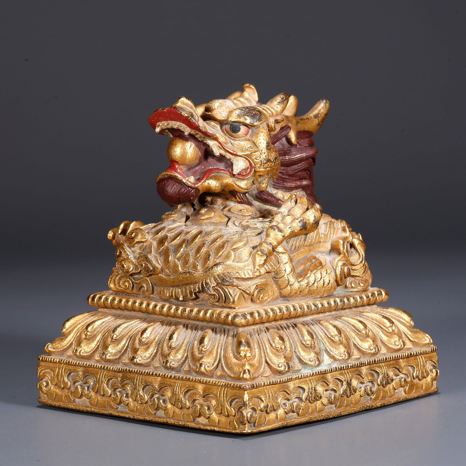 A GILDED BRONZE DRAGON-BUTTON SEAL (1 of 9)