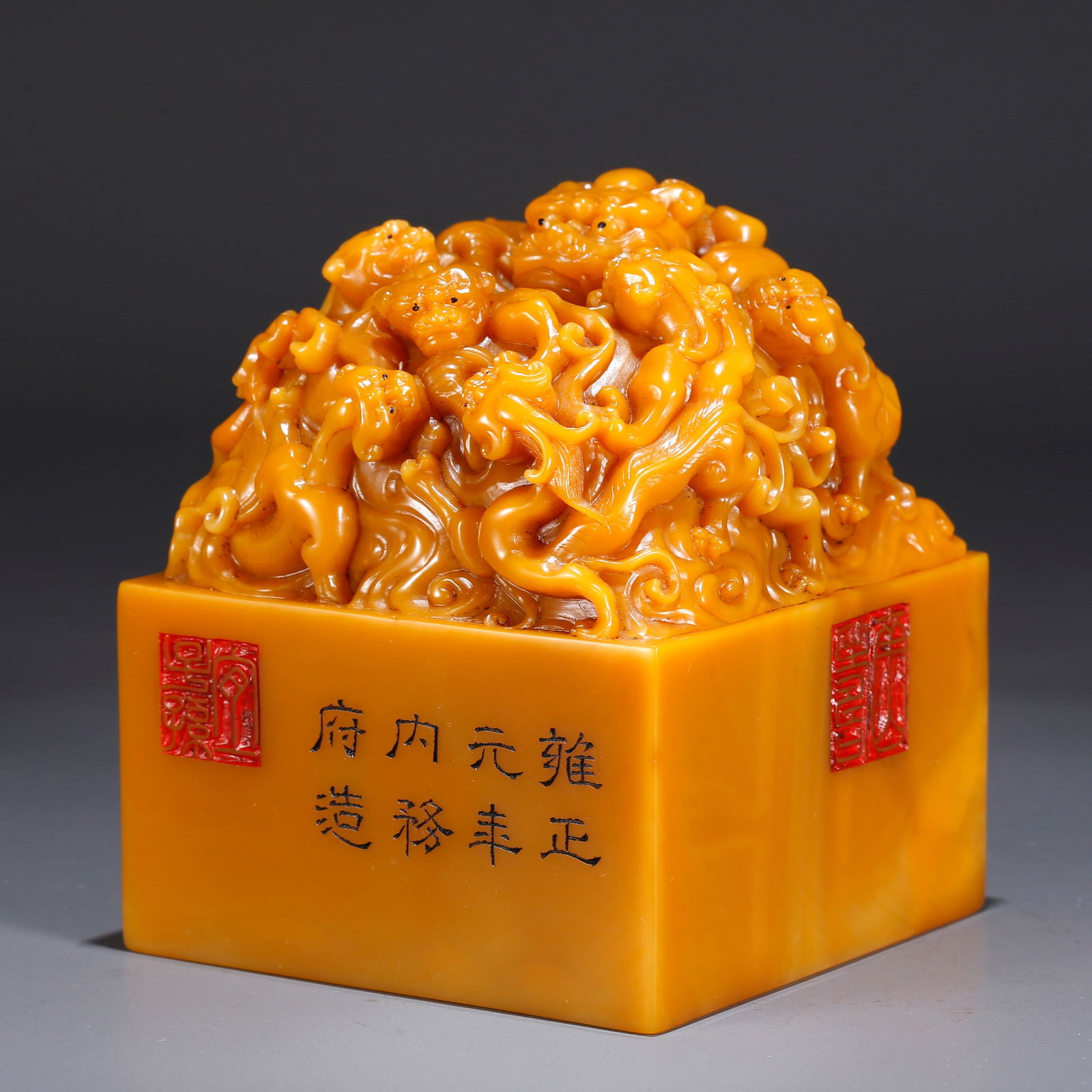 A SHOUSHAN TIANHUANG STONE SEAL WITH GROUP OF DRAGONS PATTERN: Shoushan Tianhuang stone seal with group of dragons pattern