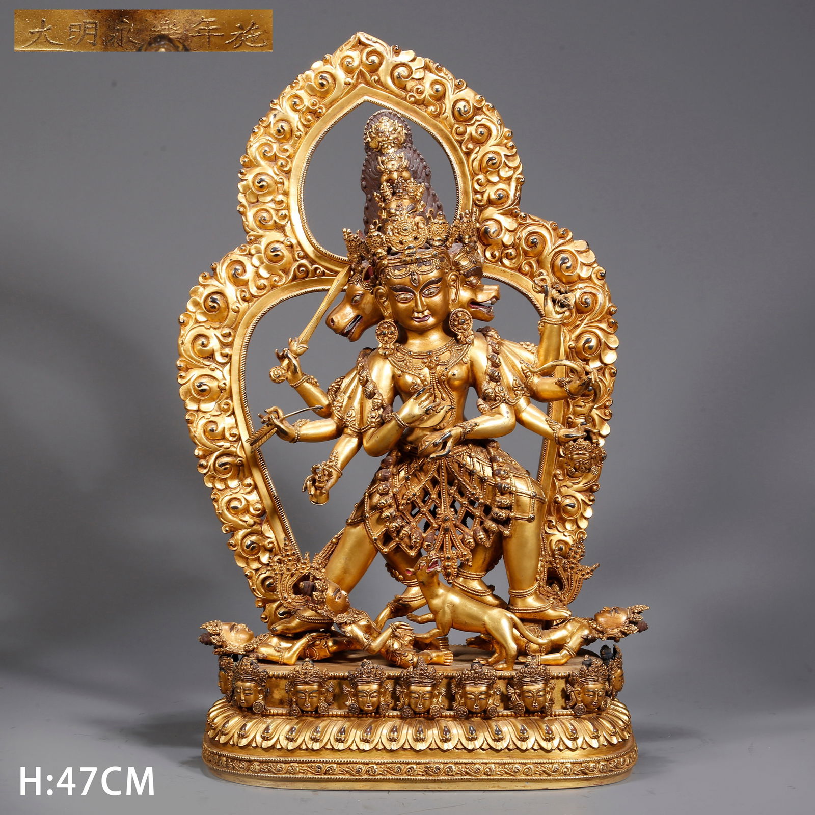 A GILDED BRONZE DHARMA PROTECTOR BUDDHA STATUE (1 of 10)