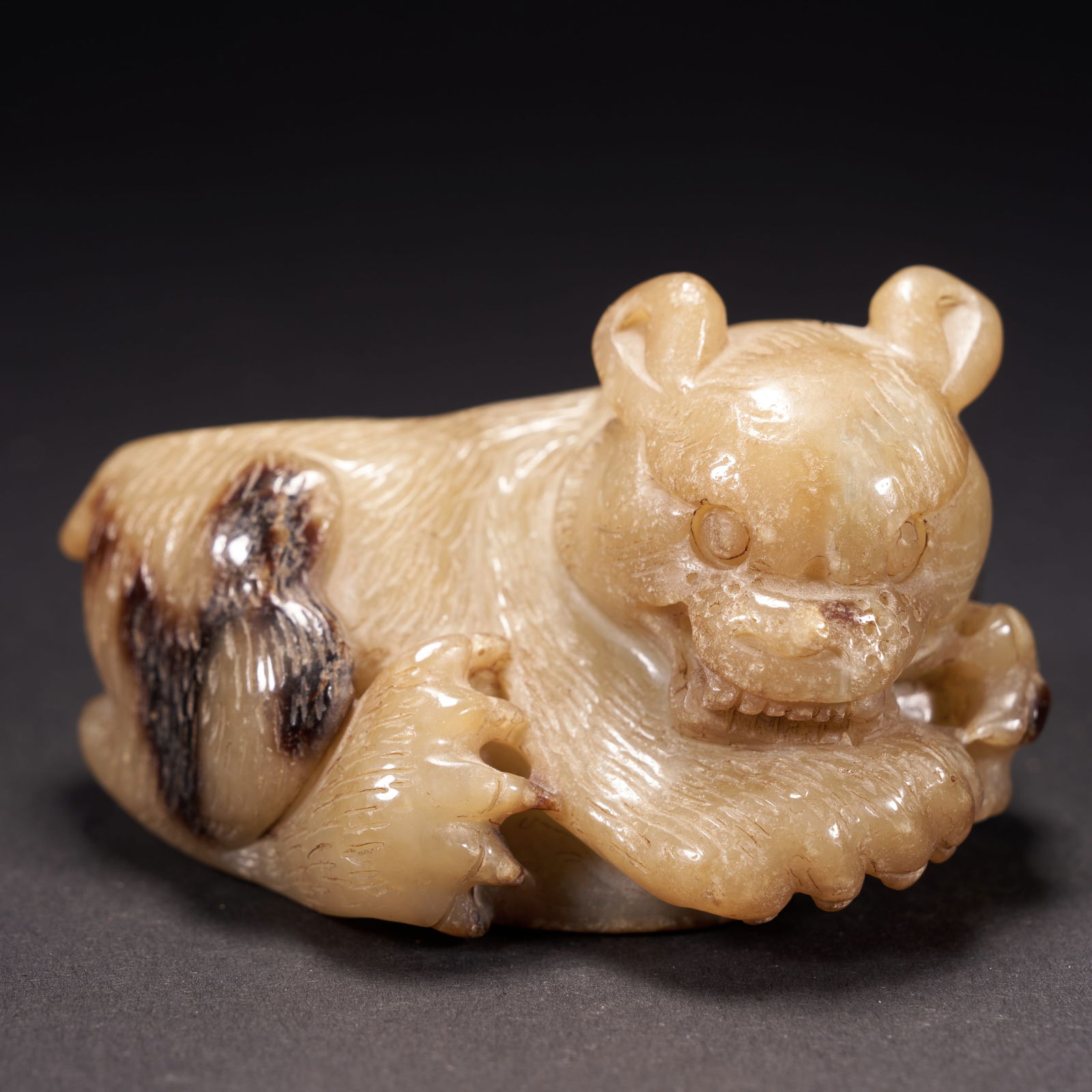 A HIGH-ARCHAIC JADE BEAR, HAN DYNASTY (1 of 9)