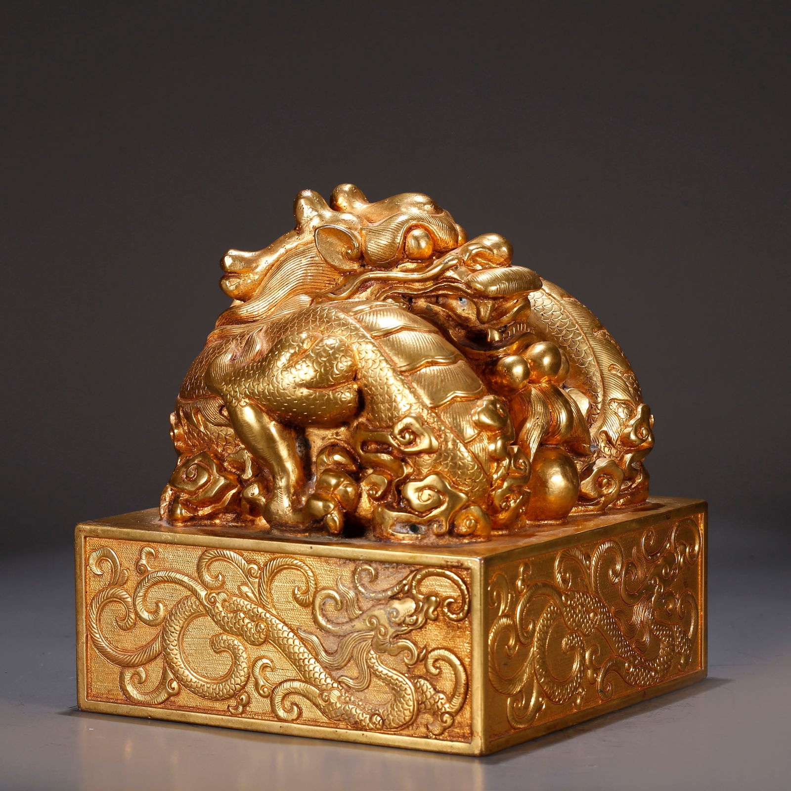 A GILT BRONZE SEAL WITH CHI DRAGON KNOB (1 of 11)