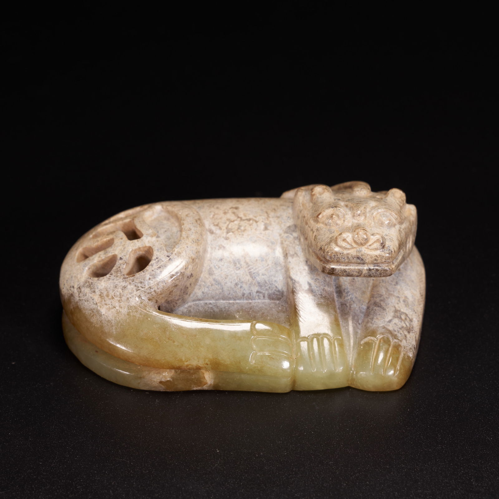 A HIGH-ANTIQUITY JADE AUSPICIOUS BEAST ORNAMENT (1 of 8)