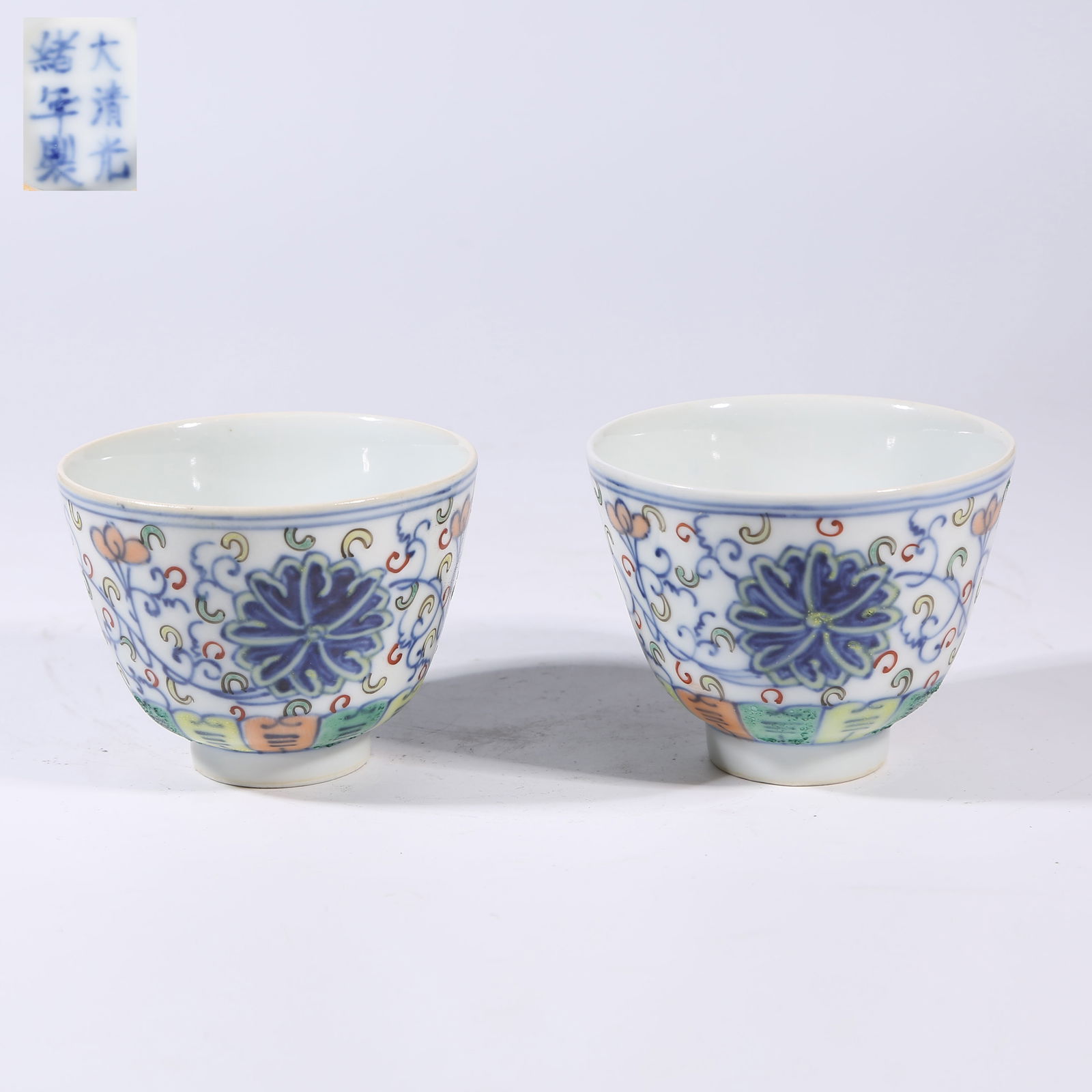 A SET OF FAMILLE-ROSE CUPS WITH INTERTWINED FLOWER MOTIF (1 of 8)