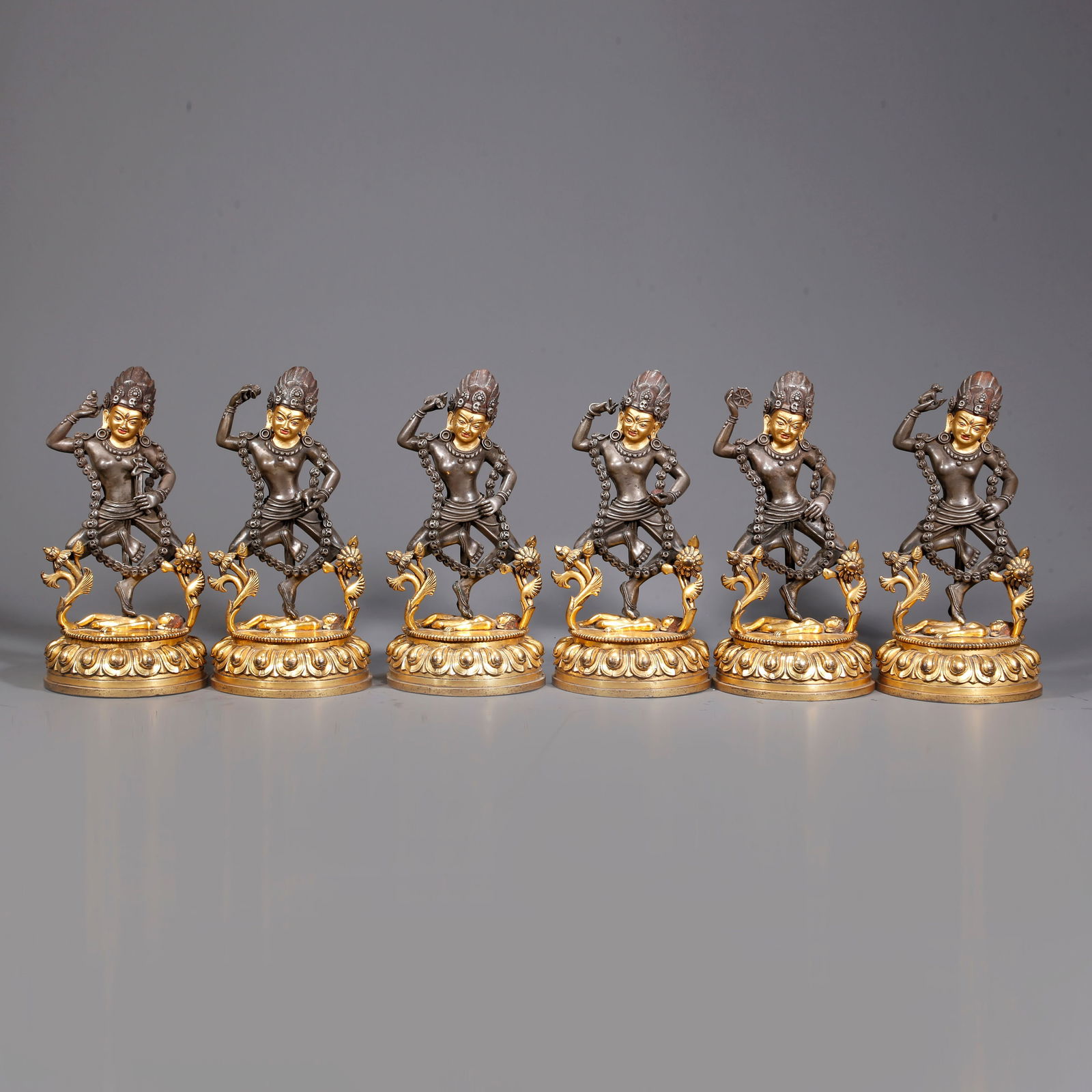A PARTIALLY GILDED SILVER DAKINI BUDDHA STATUES (A SET) (1 of 10)