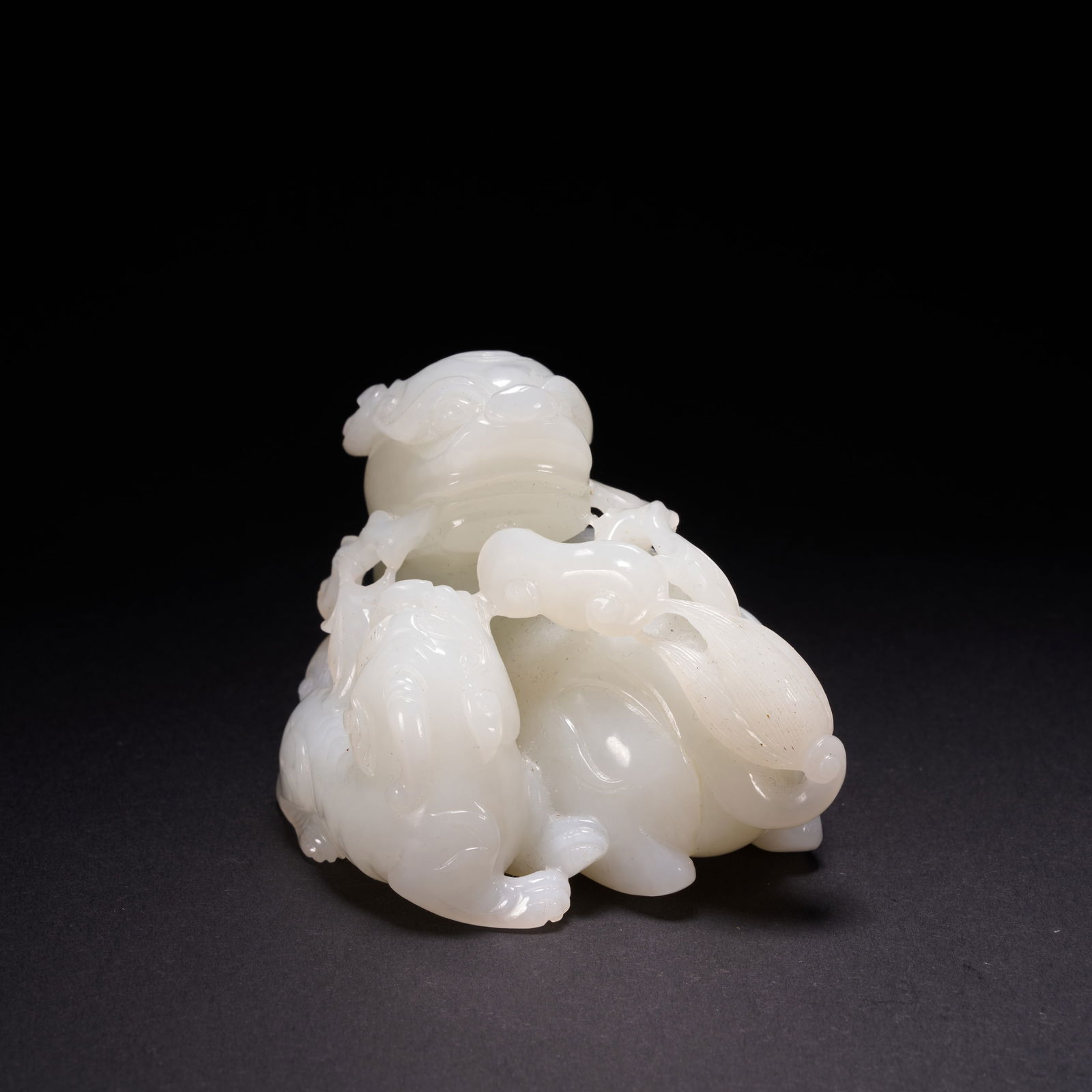 A HETIAN JADE "MOTHER-AND-CHILD BEAST" HAND-HELD CARVING, QING DYNASTY (1 of 9)