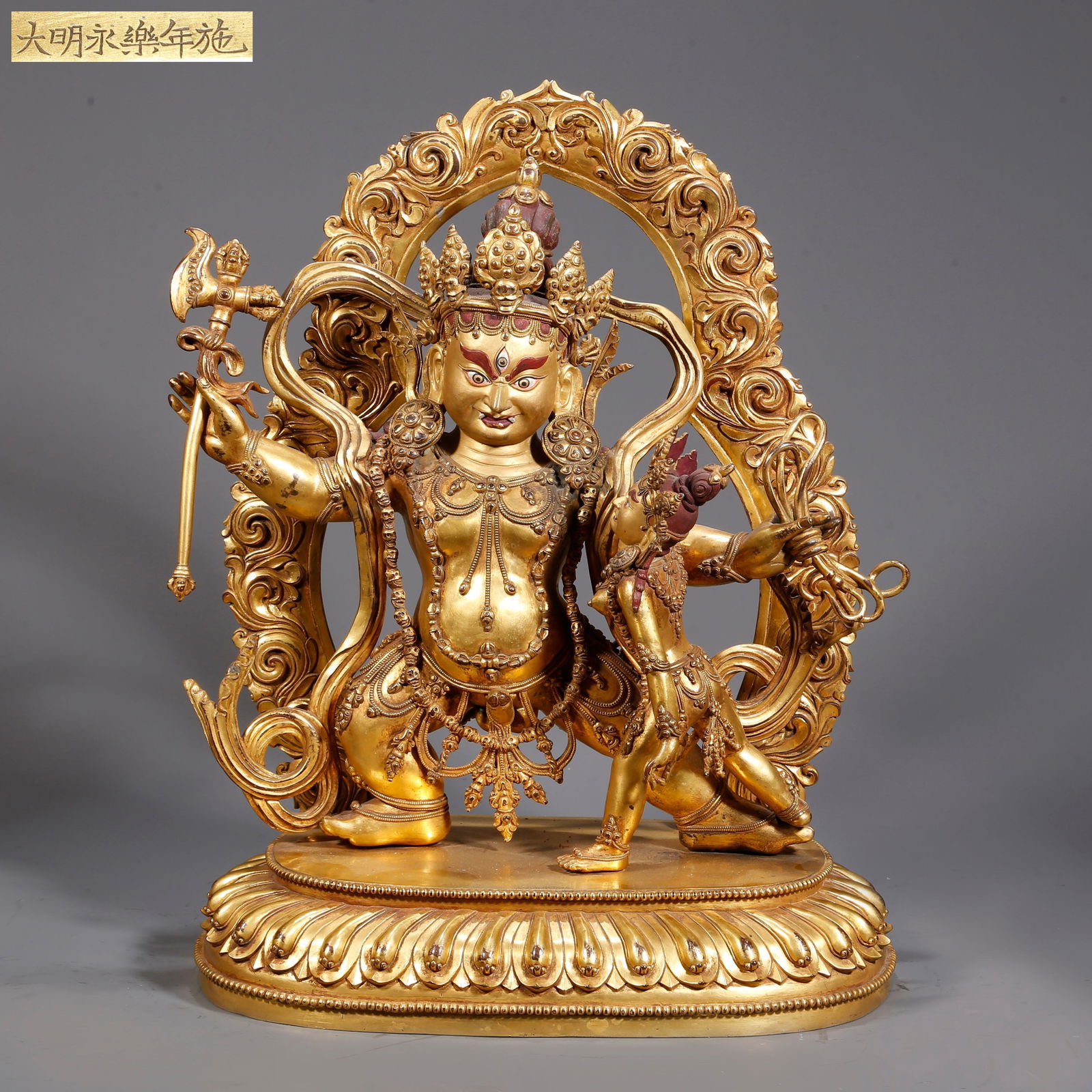 A GILDED BRONZE DHARMA PROTECTOR BUDDHA STATUE (1 of 10)