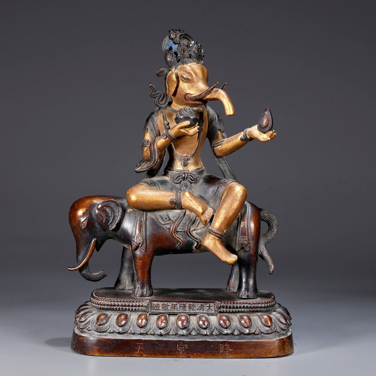 A GILDED BRONZE STATUE OF GANAPATI (ELEPHANT-TRUNKED GOD OF WEALTH) (1 of 10)