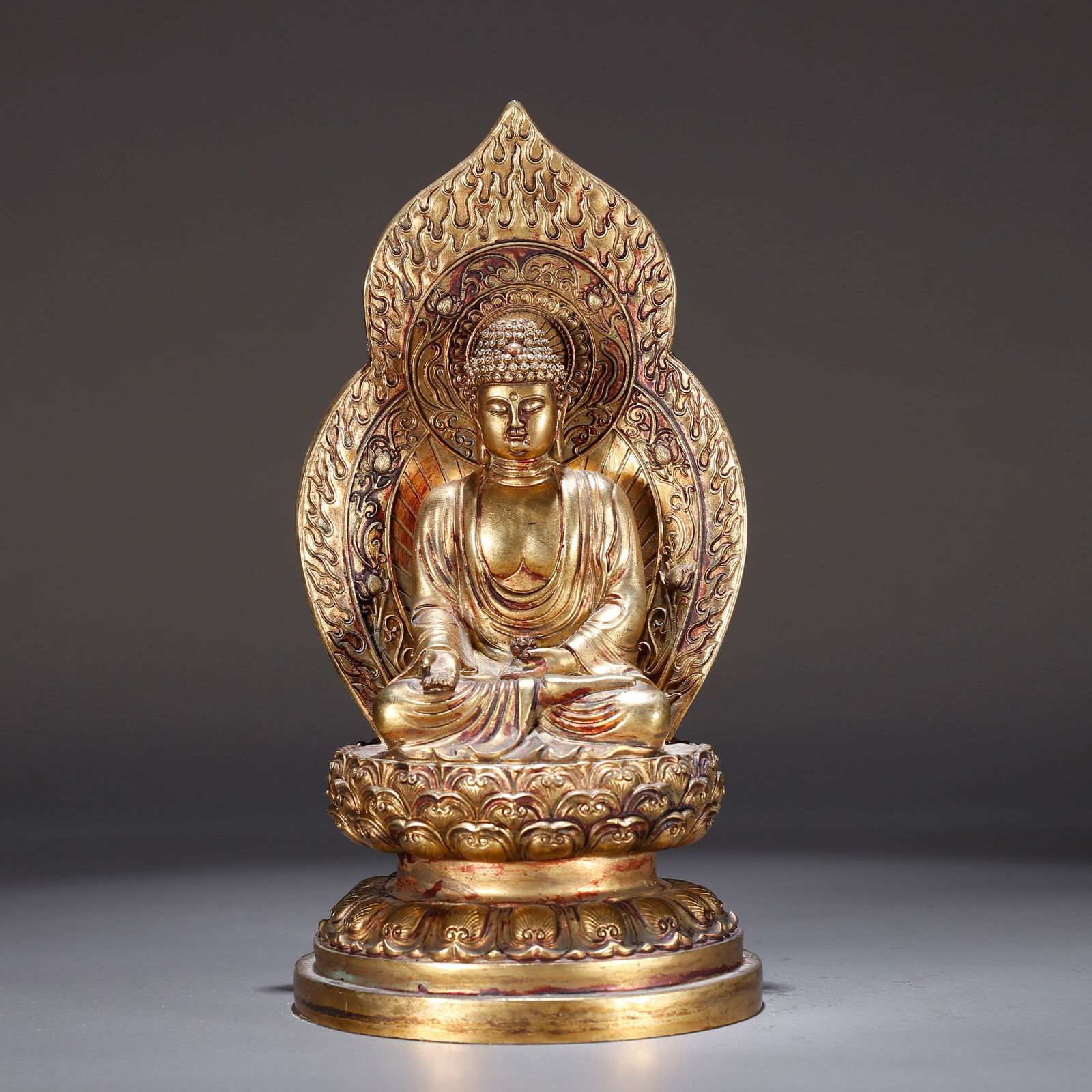 A GILT BRONZE STATUE OF VAIROCANA BUDDHA (1 of 9)