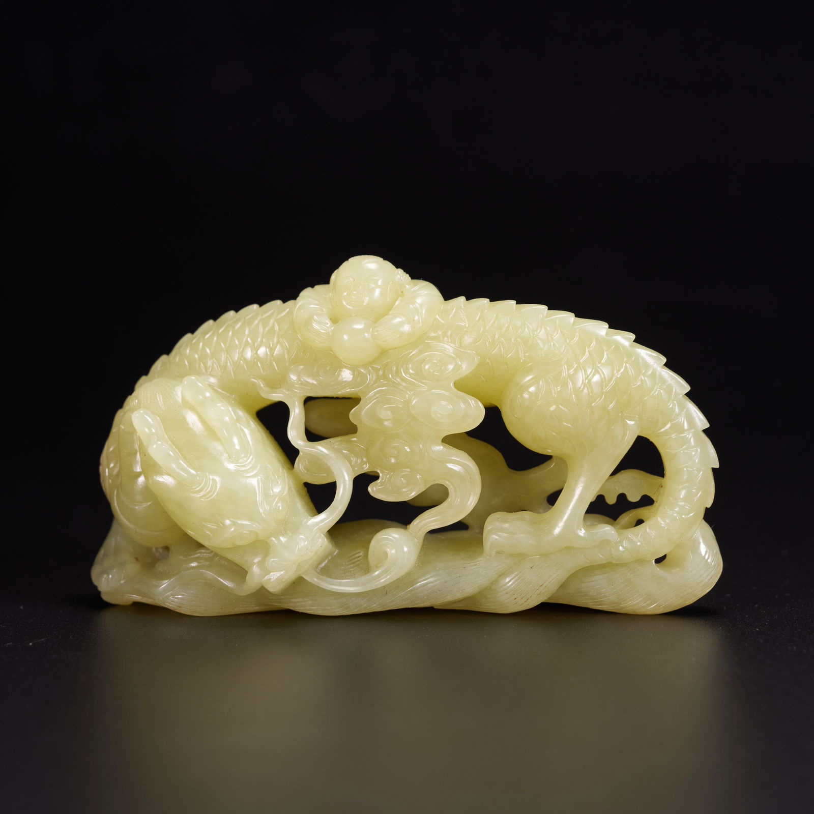 A HETIAN YELLOW JADE CLOUD-AND-DRAGON ORNAMENT (1 of 8)