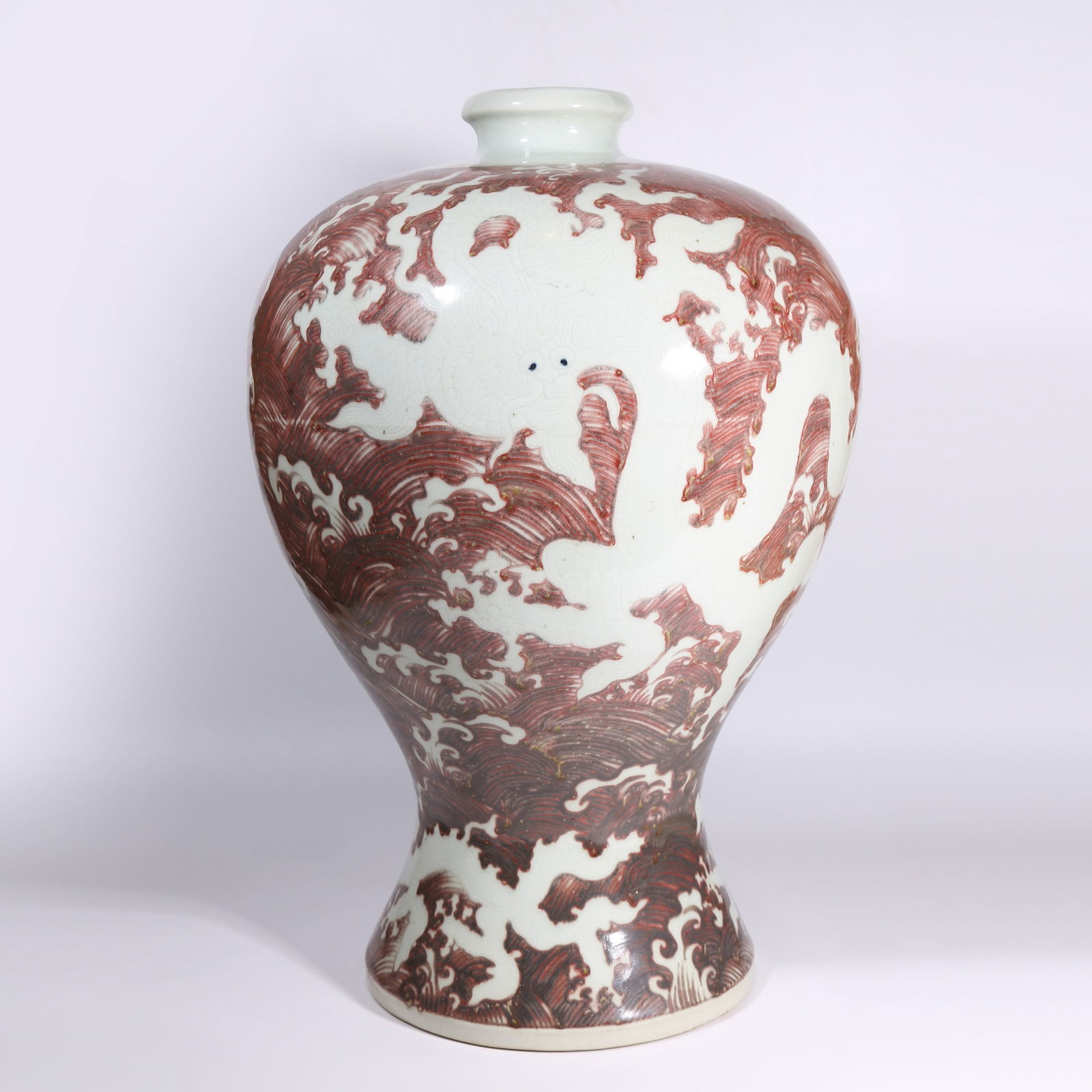 A UNDERGLAZE-RED RESERVE "DRAGON AMID WAVES" MEIPING VASE (1 of 11)