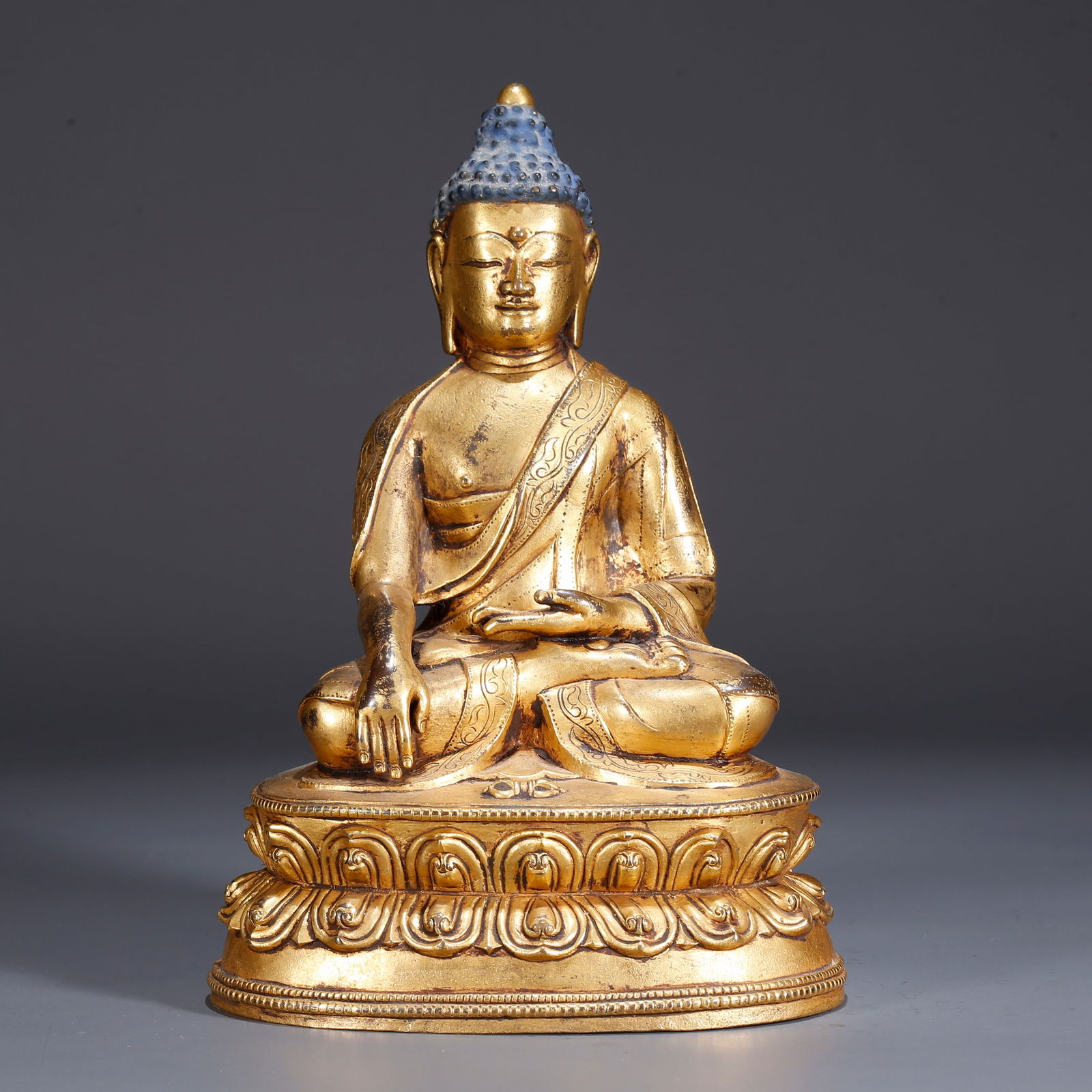 A GILDED BRONZE SHAKYAMUNI STATUE (1 of 9)