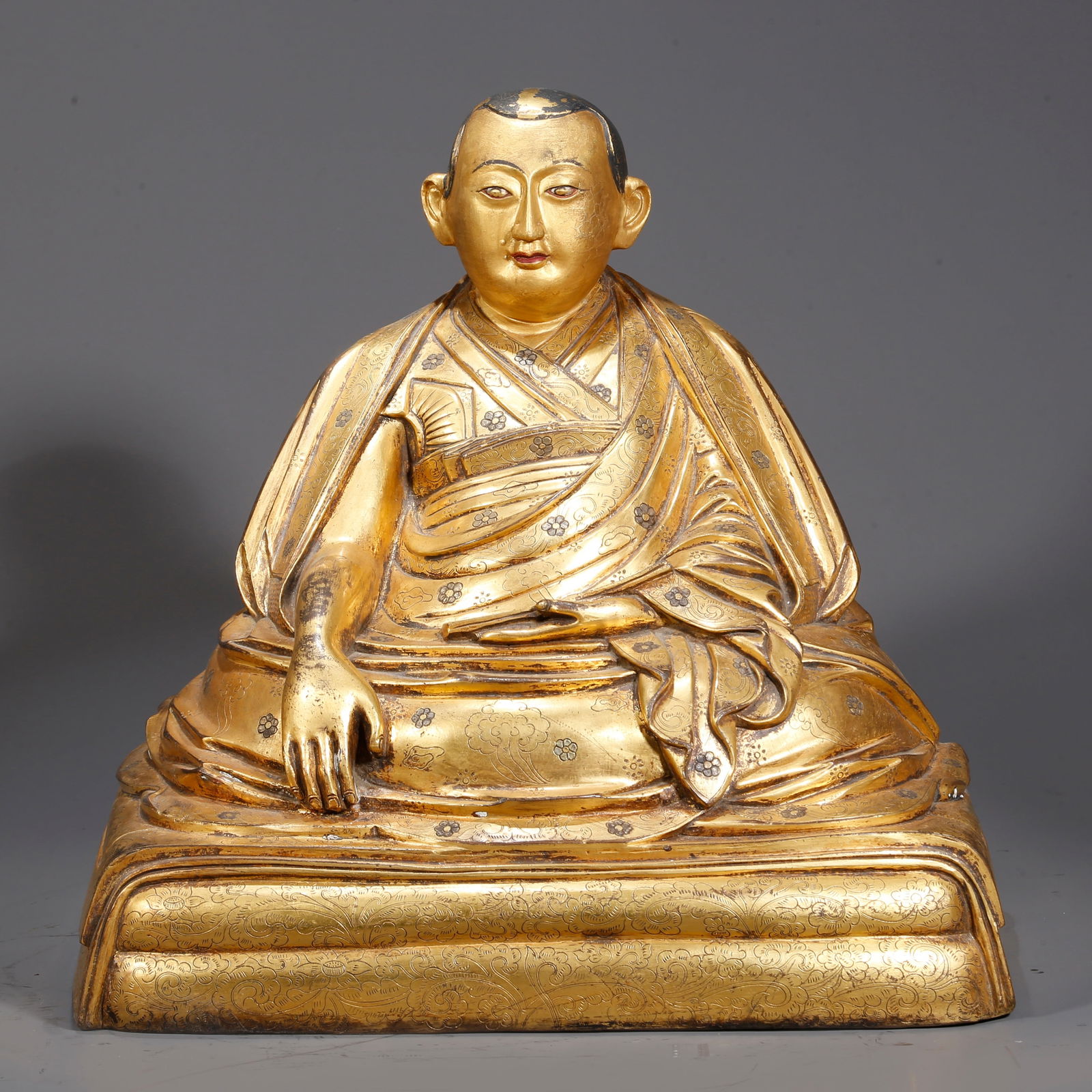A GILDED BRONZE GURU STATUE (1 of 9)