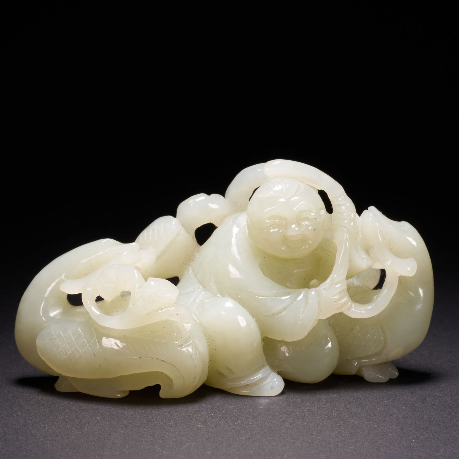 A HETIAN JADE "BOY PLAYING WITH A GOOSE" ORNAMENT, QING DYNASTY (1 of 10)