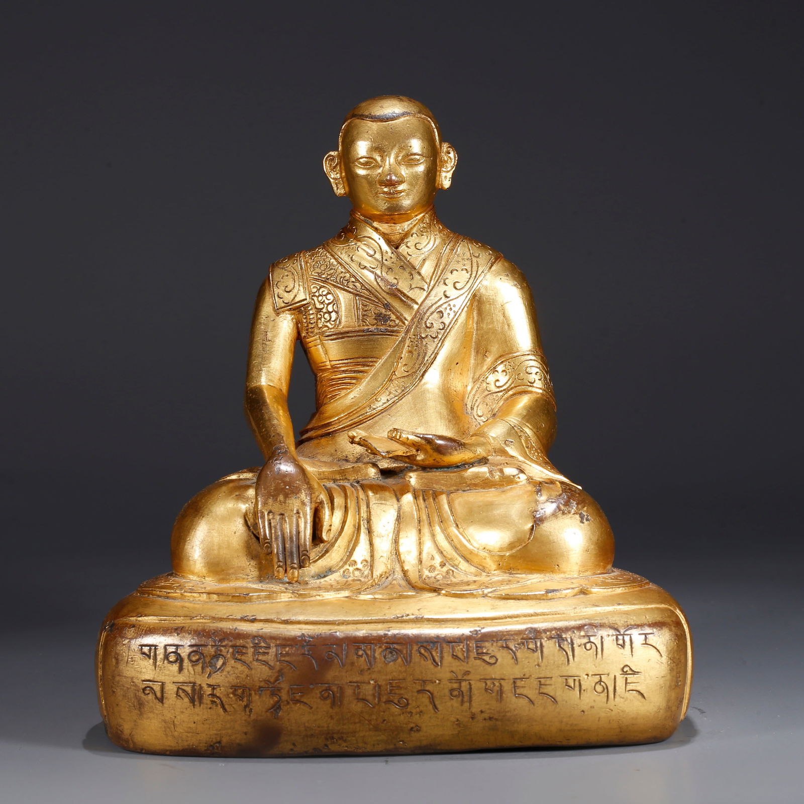 A GILDED BRONZE STATUE OF A LAMA (1 of 9)
