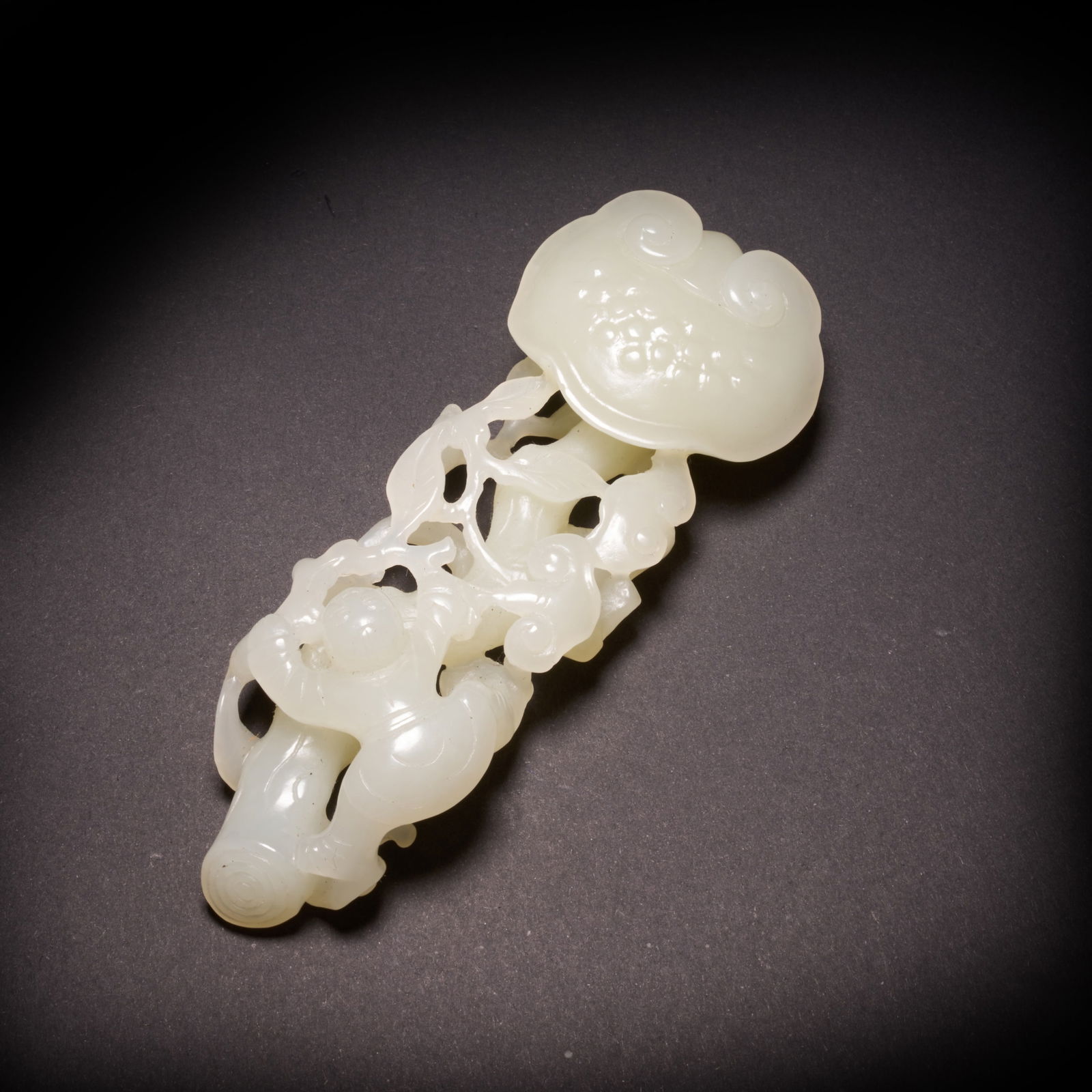 A HETIAN JADE "LINGZHI AND BOY WITH RUYI" ORNAMENT, QING DYNASTY (1 of 9)