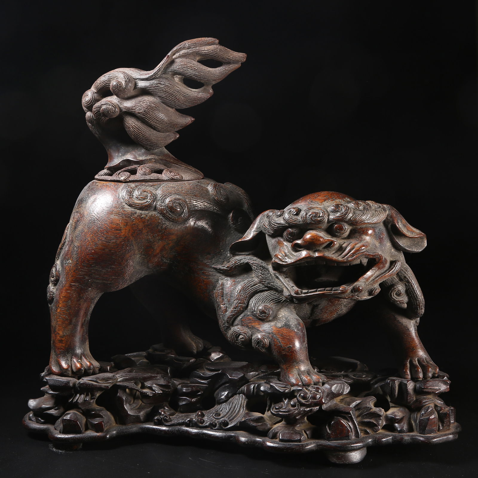 A QING DYNASTY QI NAN WOOD LION-SHAPED INCENSE BURNER: Qing Dynasty Qi Nan Wood Lion-Shaped Incense Burner